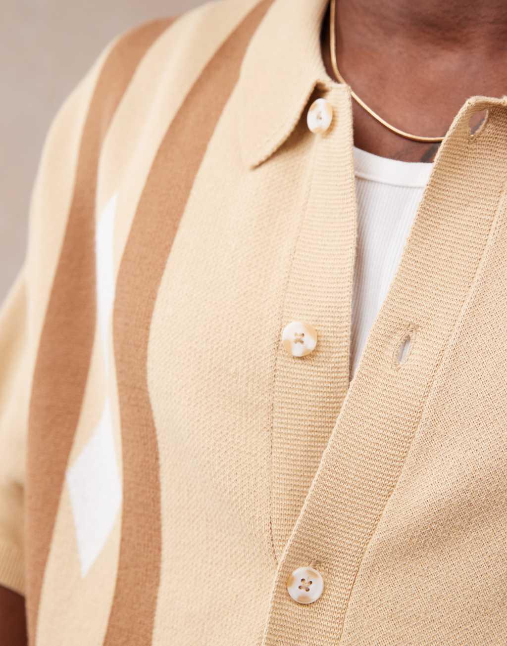 ASOS DESIGN relaxed boxy fit knit button through polo with argyle pattern in beige Product Image