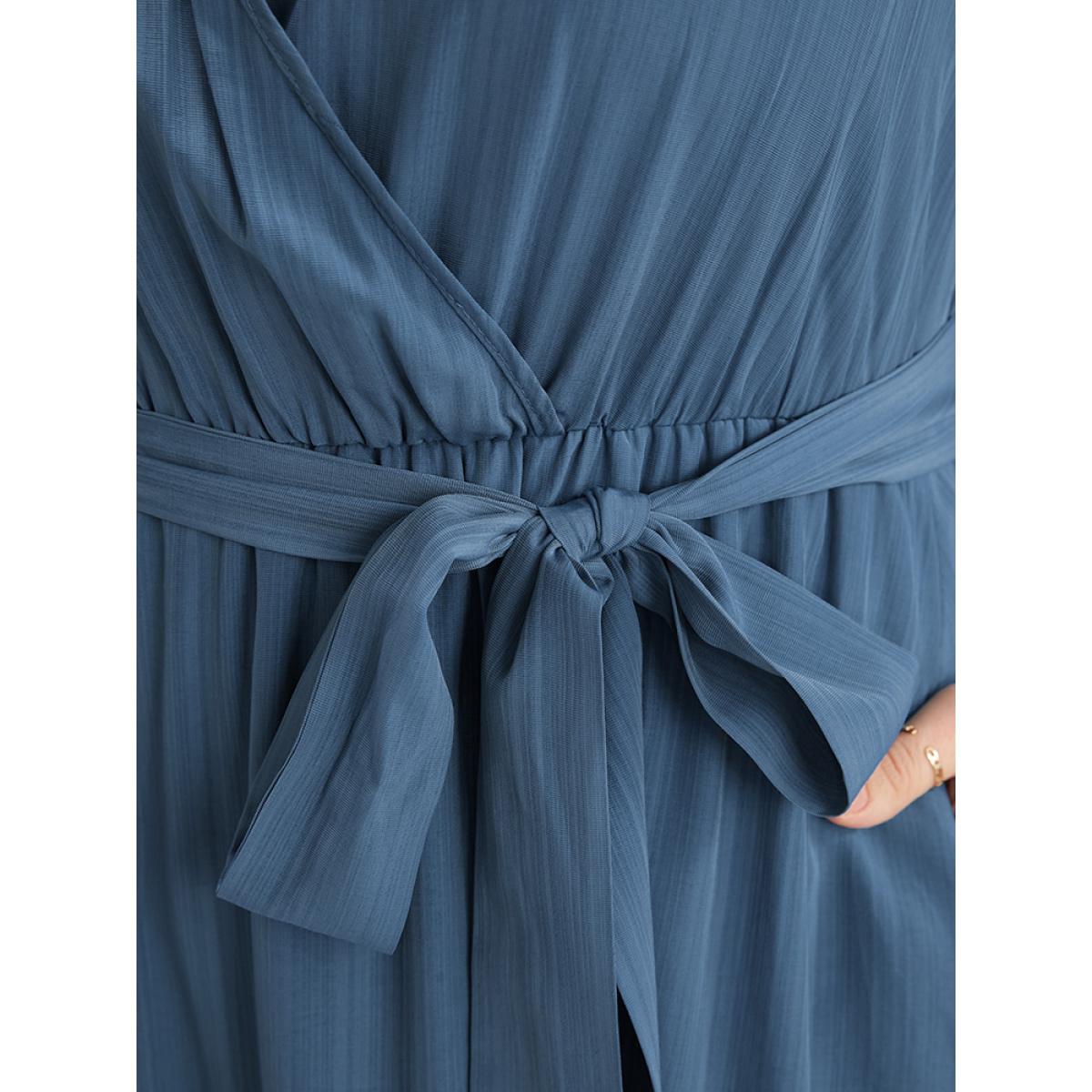 Plus Size Solid Surplice Neck Lantern Sleeve Pocket Belted Asymmetrical Hem Dress Cerulean Women Elegant Asymmetrical V-neck Long Sleeve Curvy Midi Dress BloomChic 30/6X Product Image