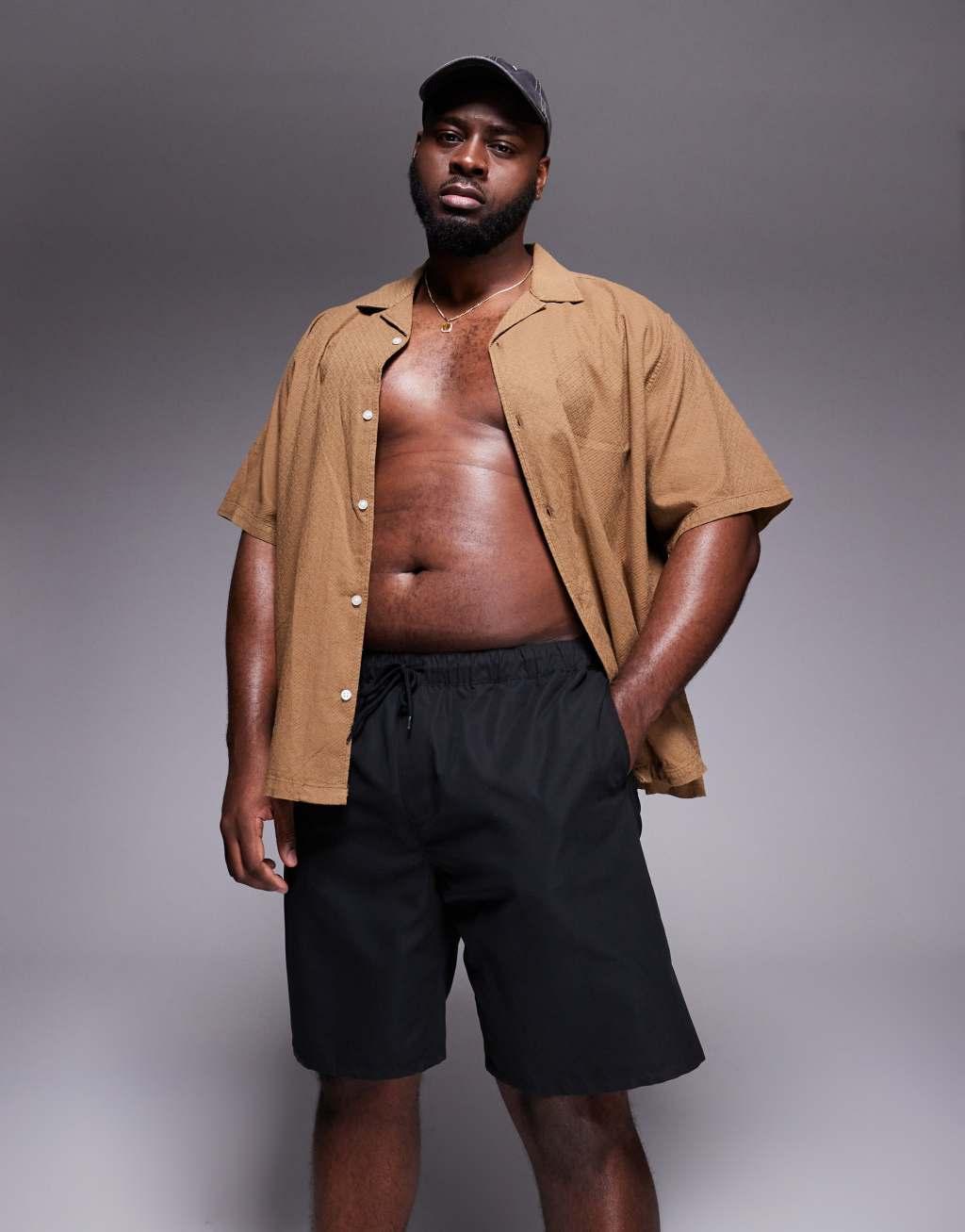 ASOS DESIGN swim shorts in long length in black Product Image