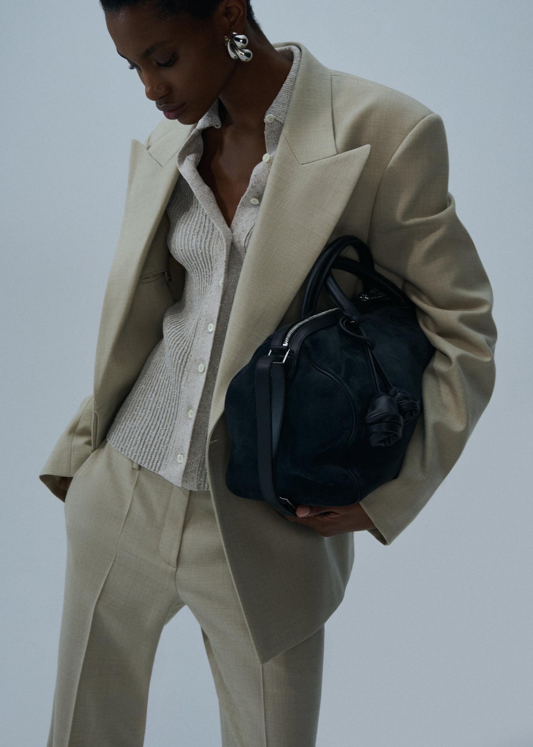 Front-pleat classic trousers in beige Product Image