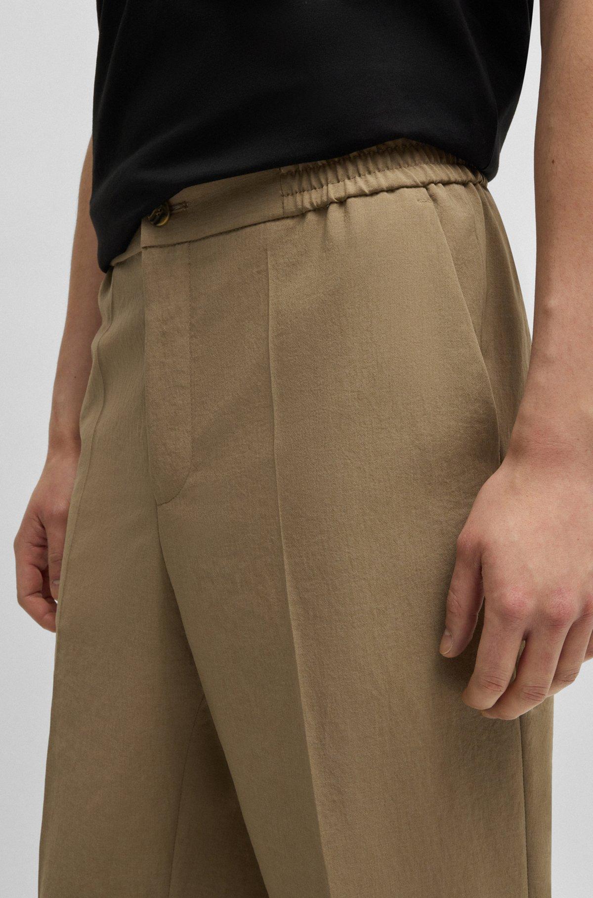 Slim-fit trousers in melange wrinkle-resistant fabric Product Image