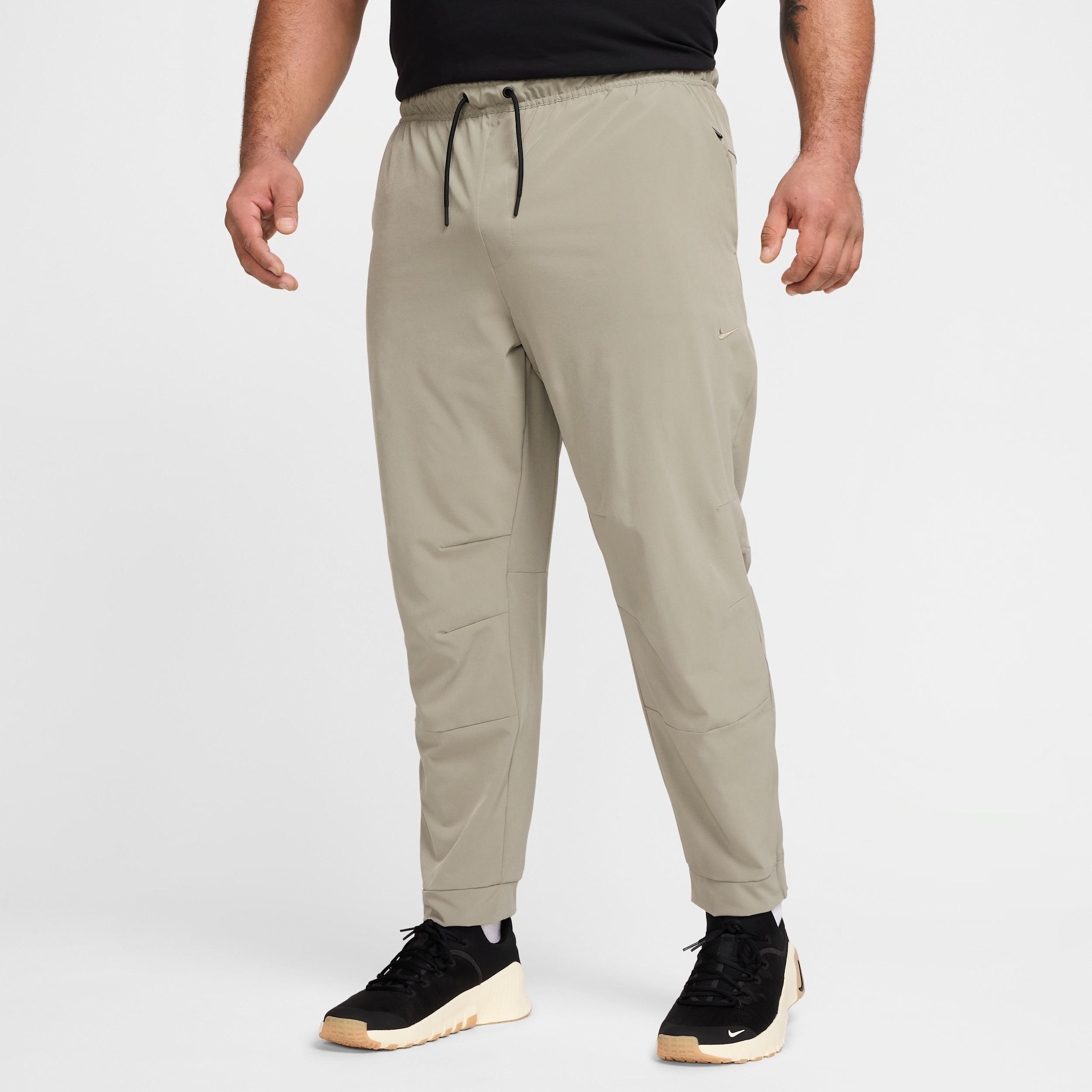 Nike Mens Unlimited Dri-FIT Zippered Cuff Versatile Pants | FB7548-320 Product Image
