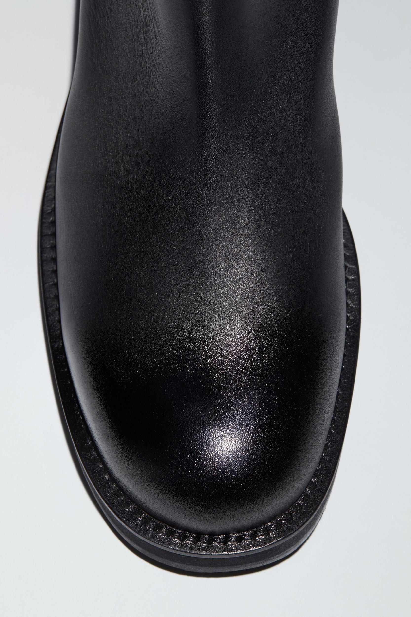Glossed low leather boots Product Image