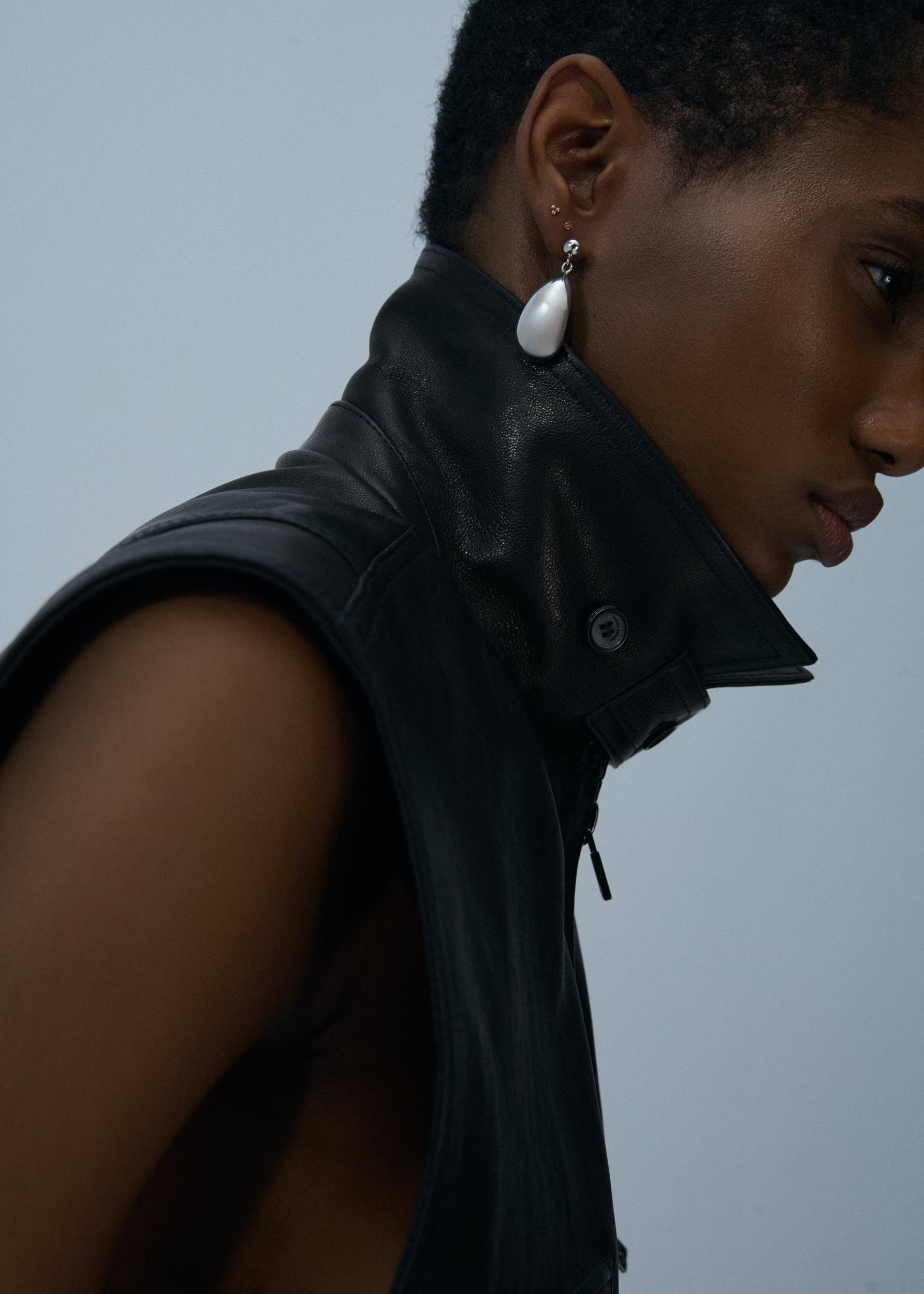 Leather peplum vest in black Product Image