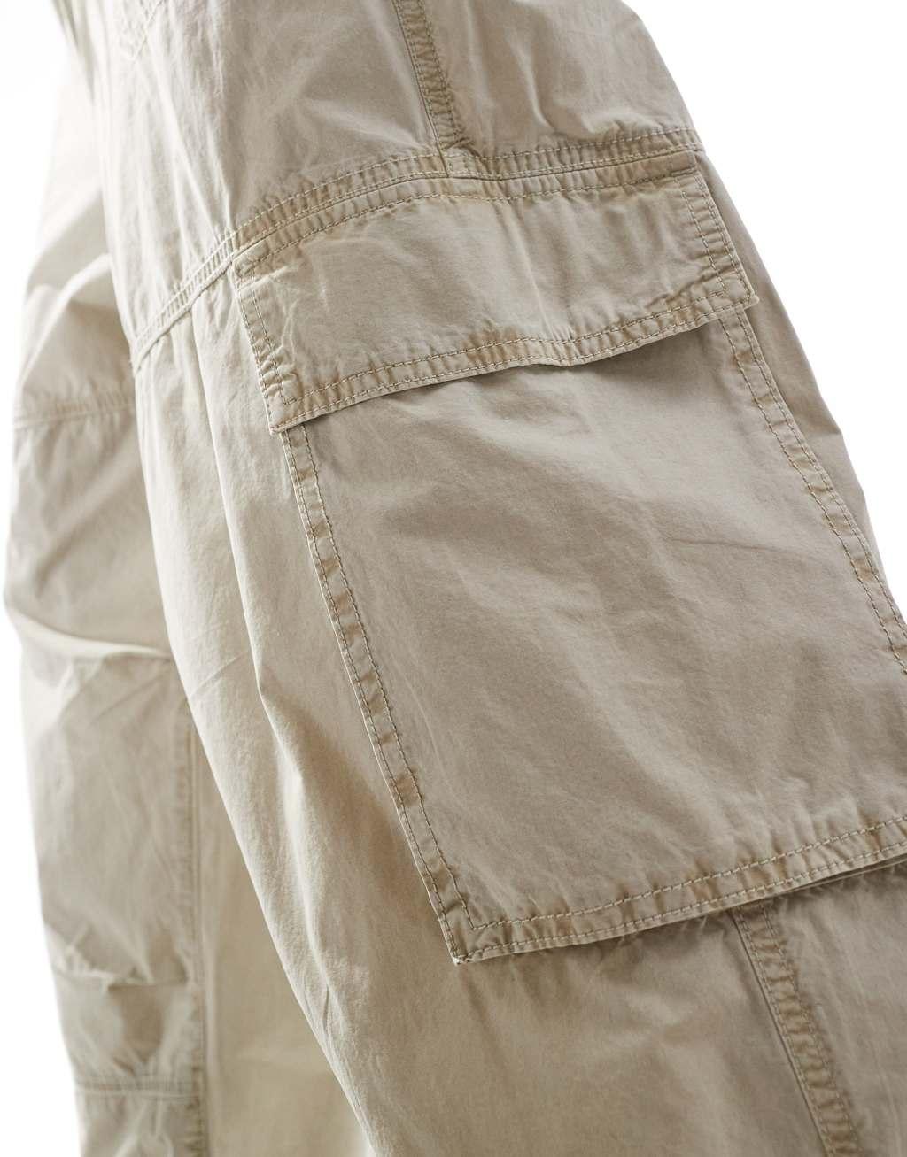 ASOS DESIGN washed baggy cargo pants with panel detailing in stone Product Image