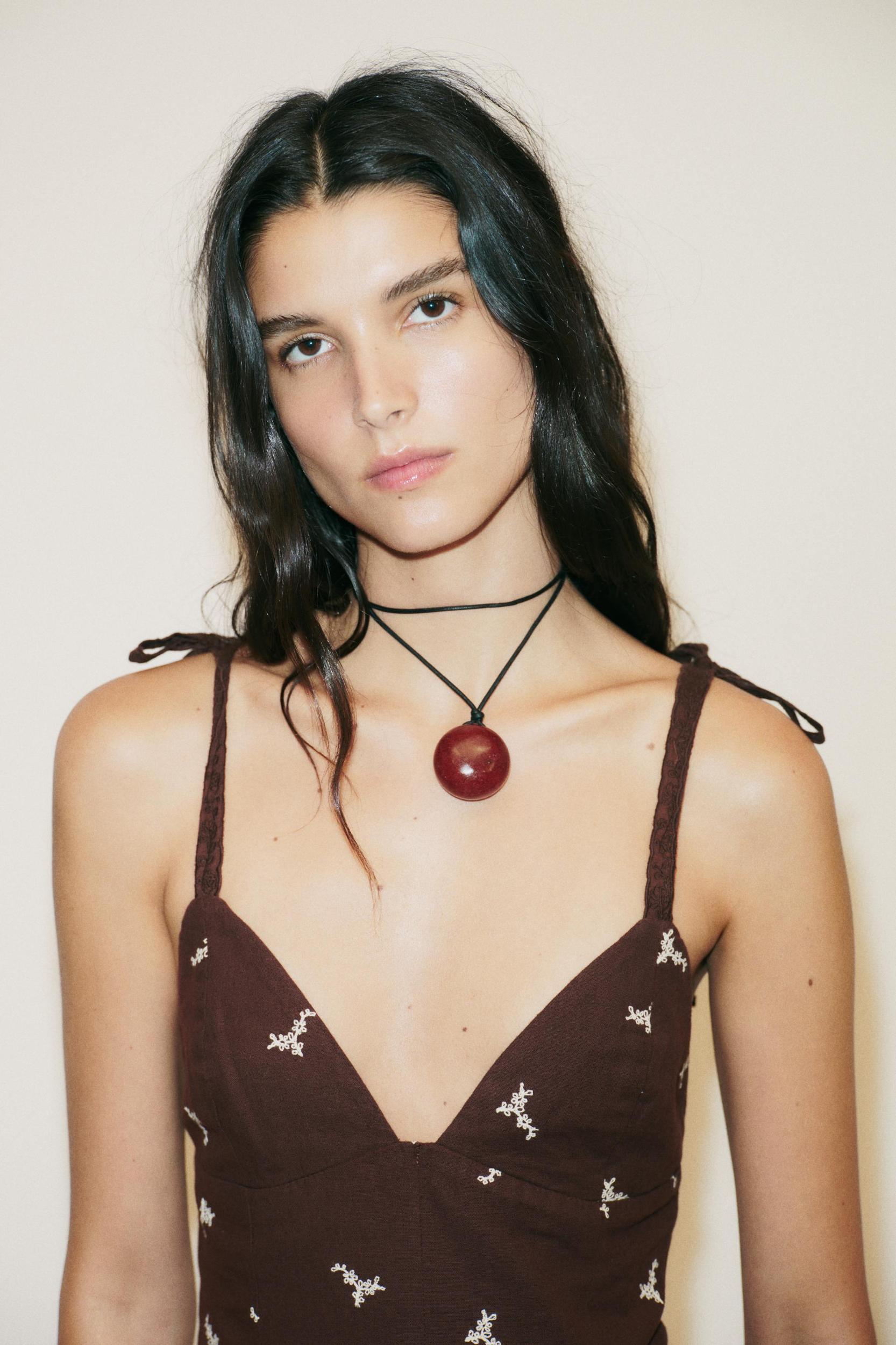 EMBROIDERED PEPLUM TOP Product Image