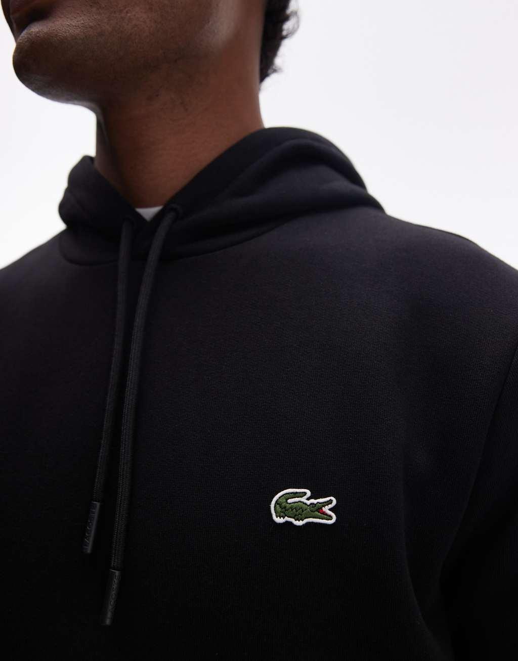 Lacoste pull over hoodie in black  Product Image