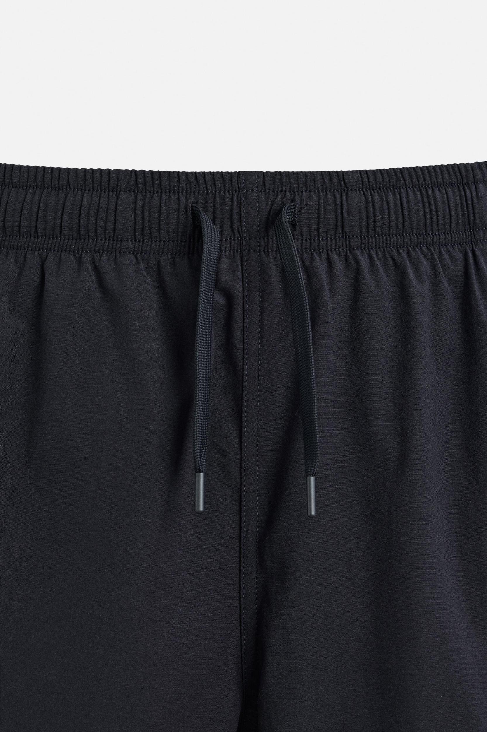 LONG CHECKERED BANDS SWIMSUIT Product Image