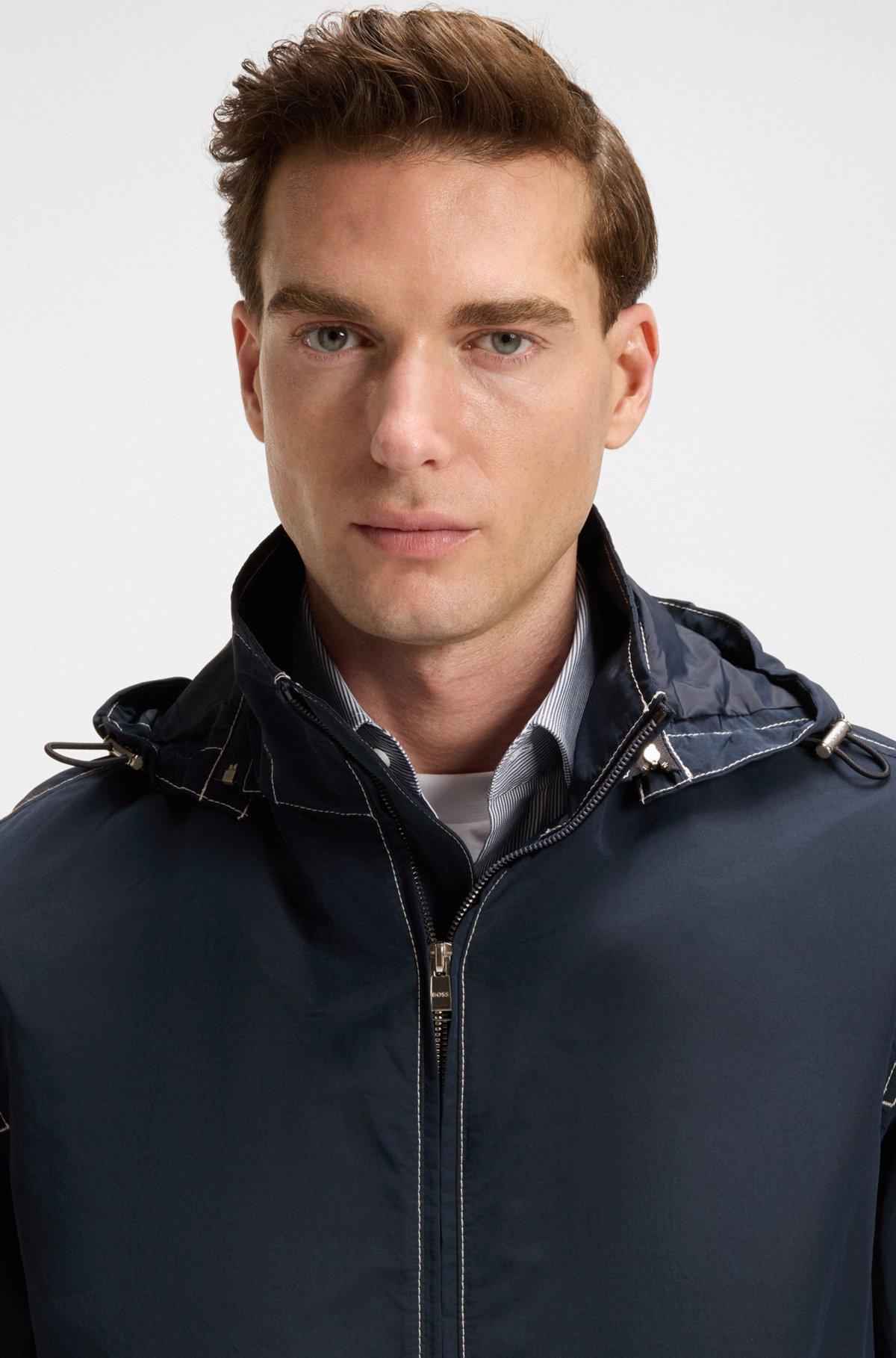 Packable hooded jacket in water-repellent mixed fabrics Product Image