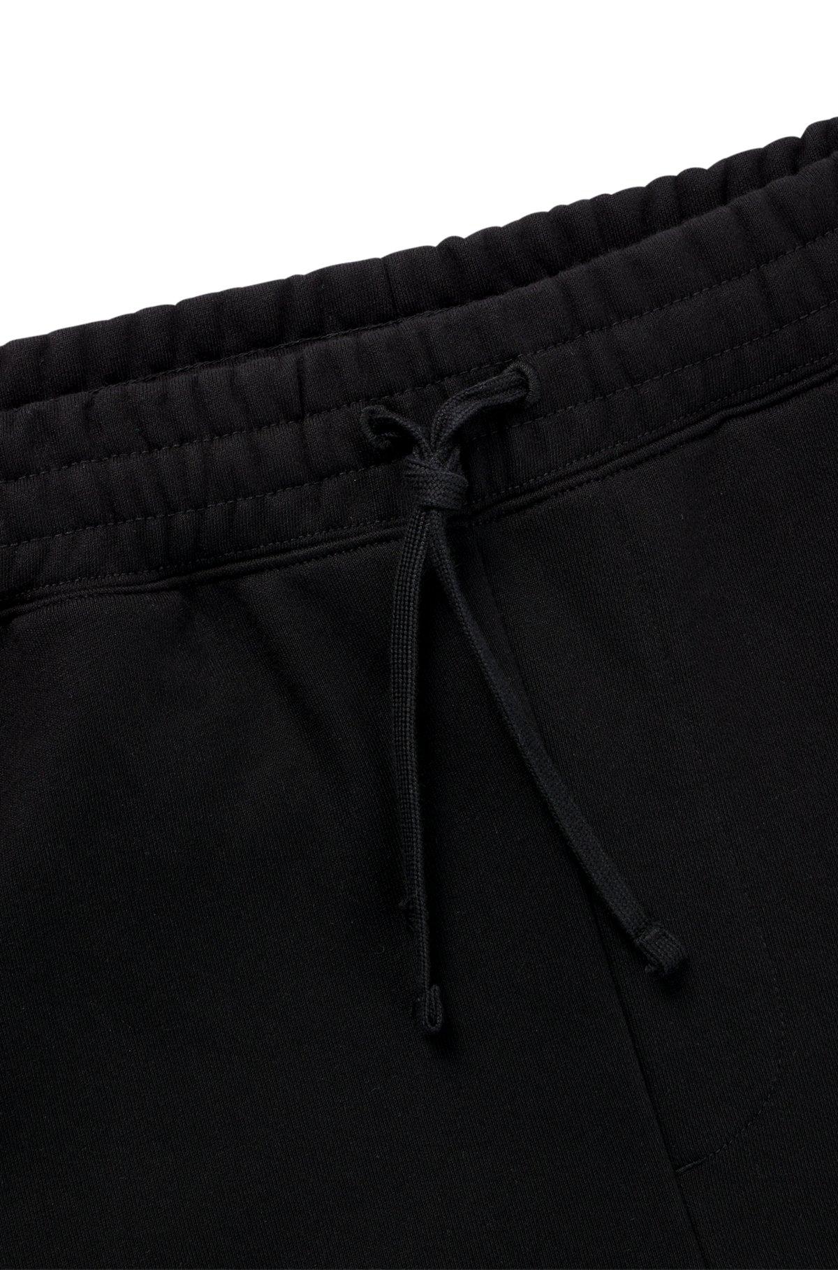 Cotton-terry tracksuit bottoms with puffed flame logo Product Image