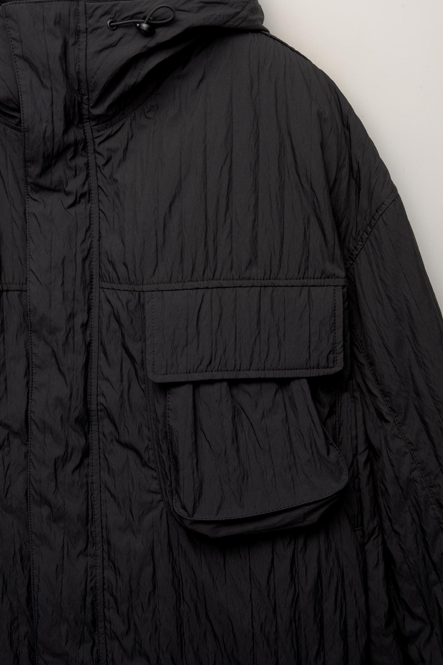 Creased raincoat with hood Product Image