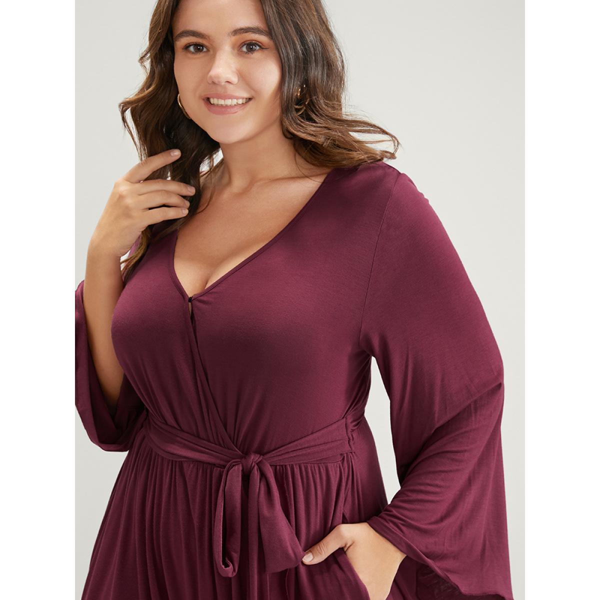 Plus Size Solid Wrap Knotted Front Pocket Bell Sleeve Asymmetrical Hem Dress Burgundy Women Elegant Wrap V-neck Long Sleeve Curvy Midi Dress BloomChic 14-16/1X Product Image