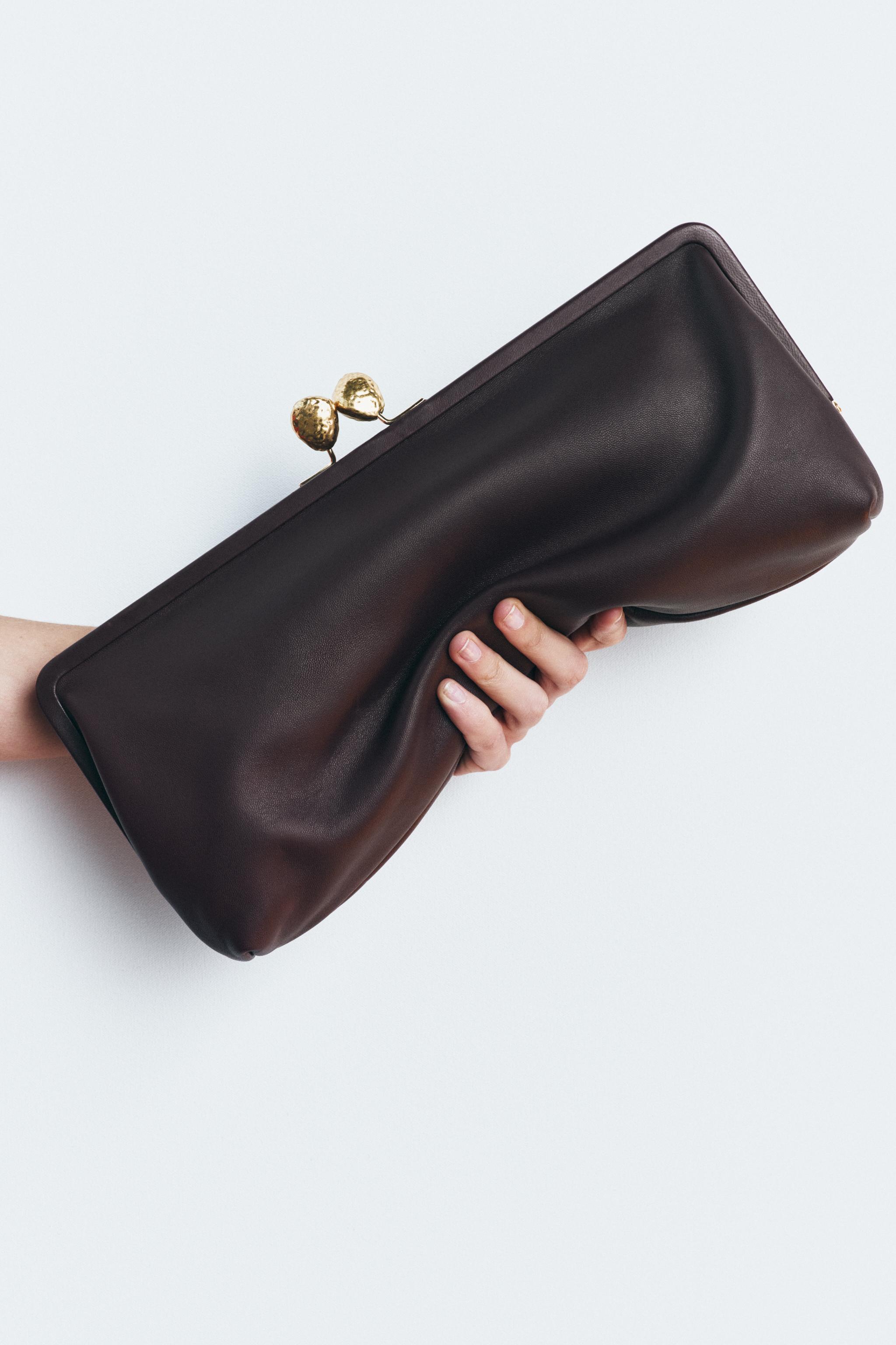 METAL TRIM LEATHER CLUTCH Product Image