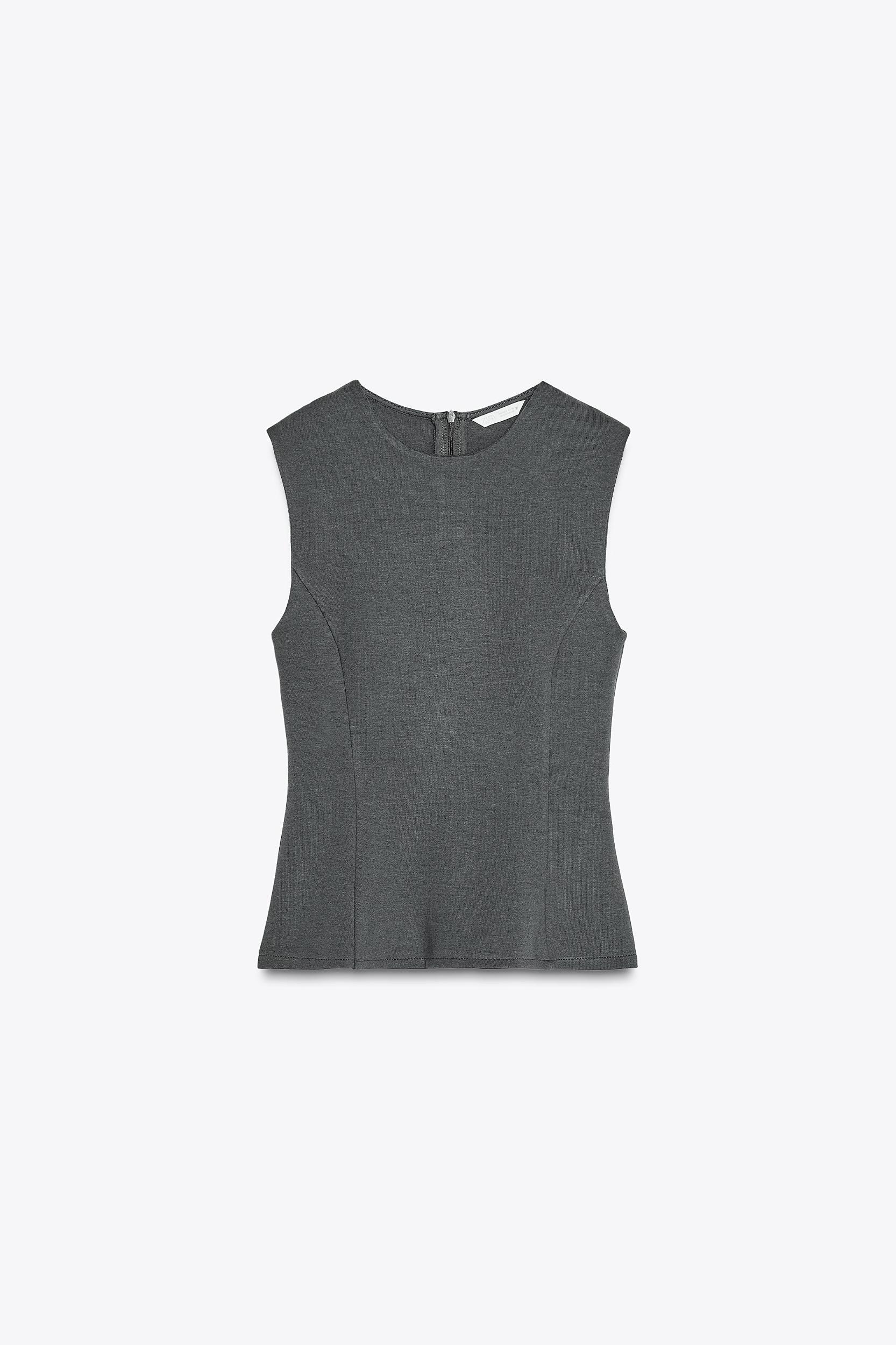 PEPLUM INTERLOCK TOP Product Image