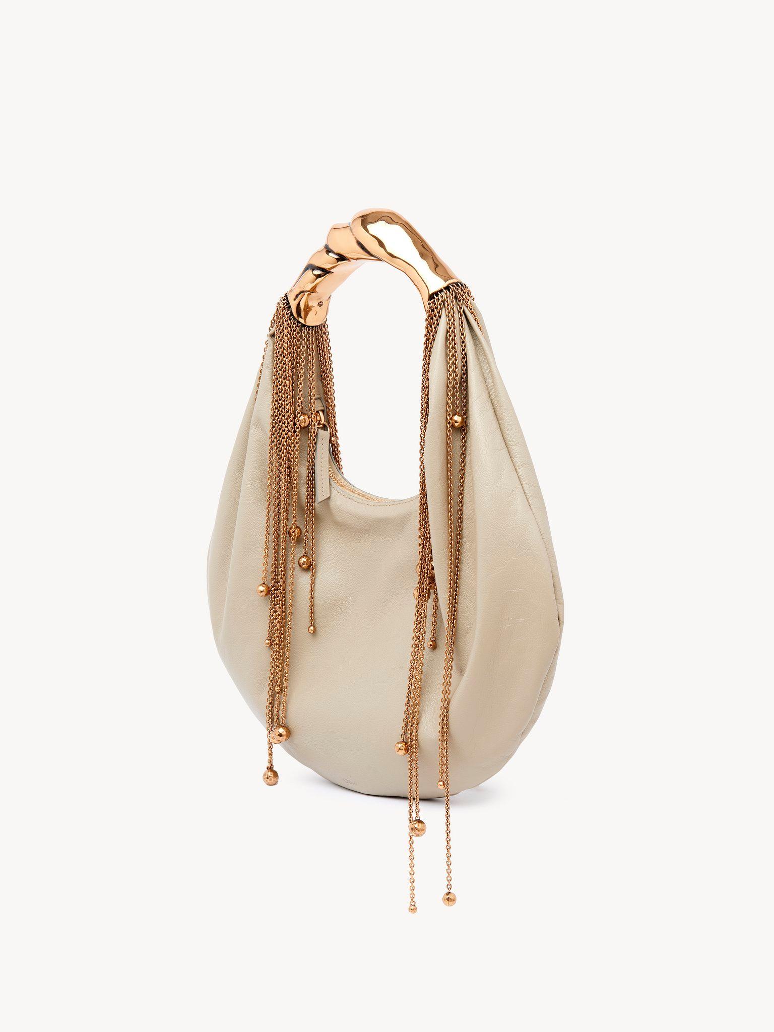 Twisted Shell hobo bag in shiny leather  Product Image