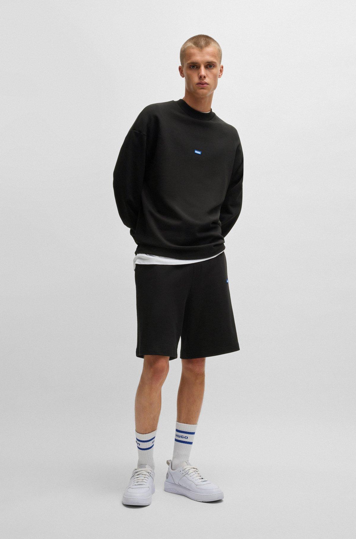 Cotton-terry shorts with blue logo patch Product Image
