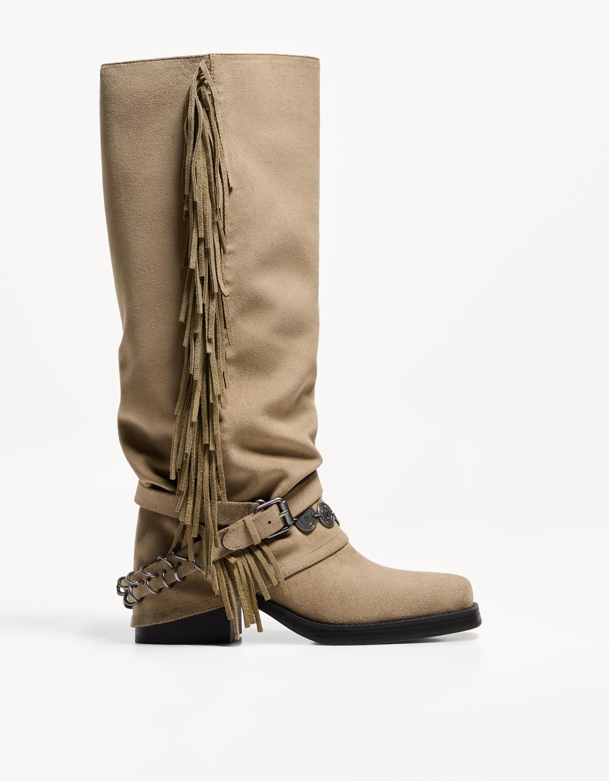 Flat boots with fringed pants Product Image