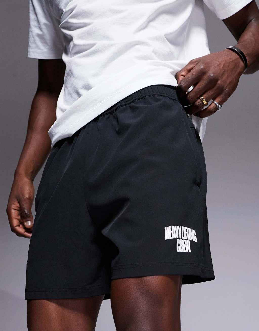 4505 7 inch wide leg quick dry graphic training shorts with towel loop and zip pockets in black  Product Image