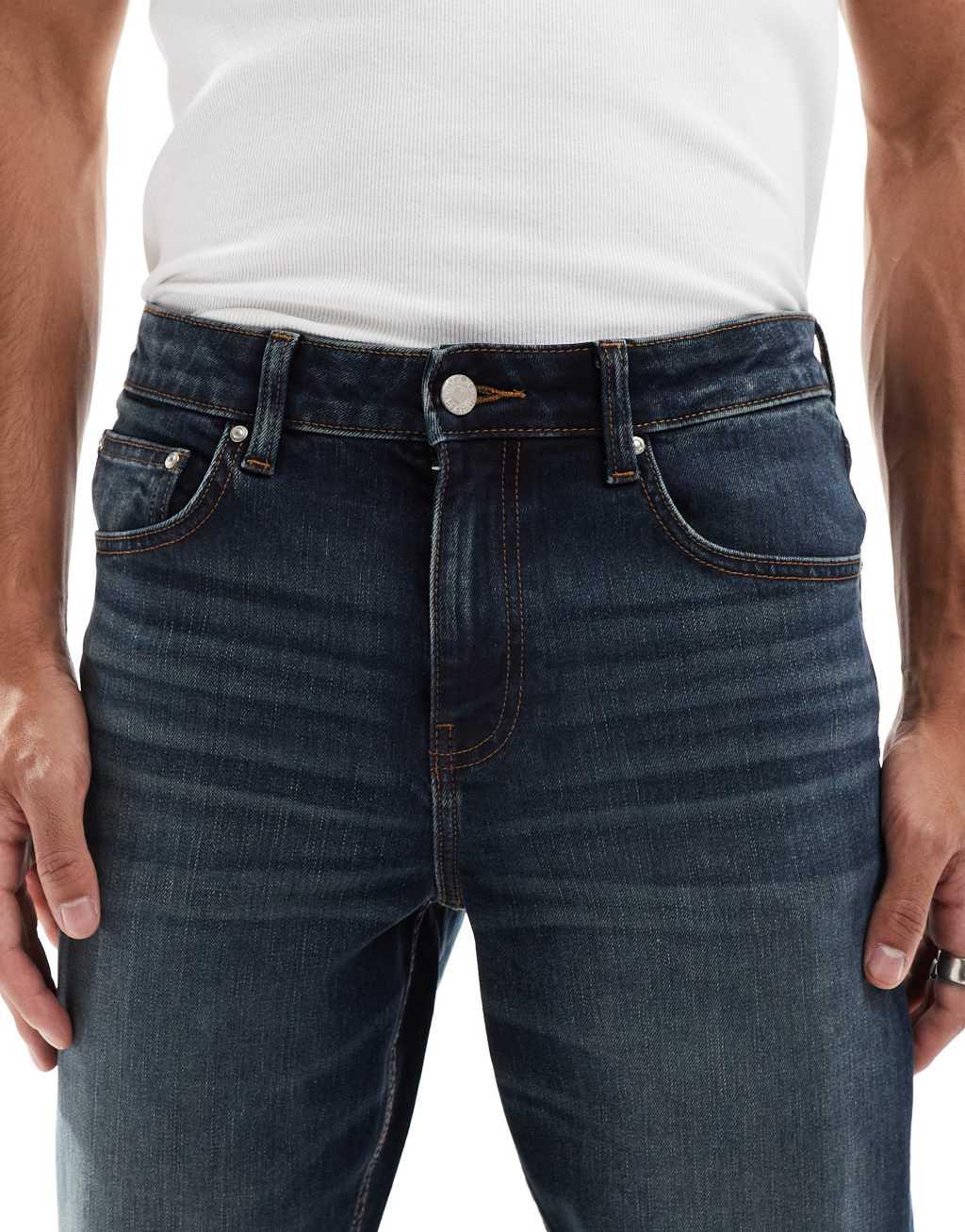 ASOS DESIGN slim jeans with tint in dark wash blue Product Image