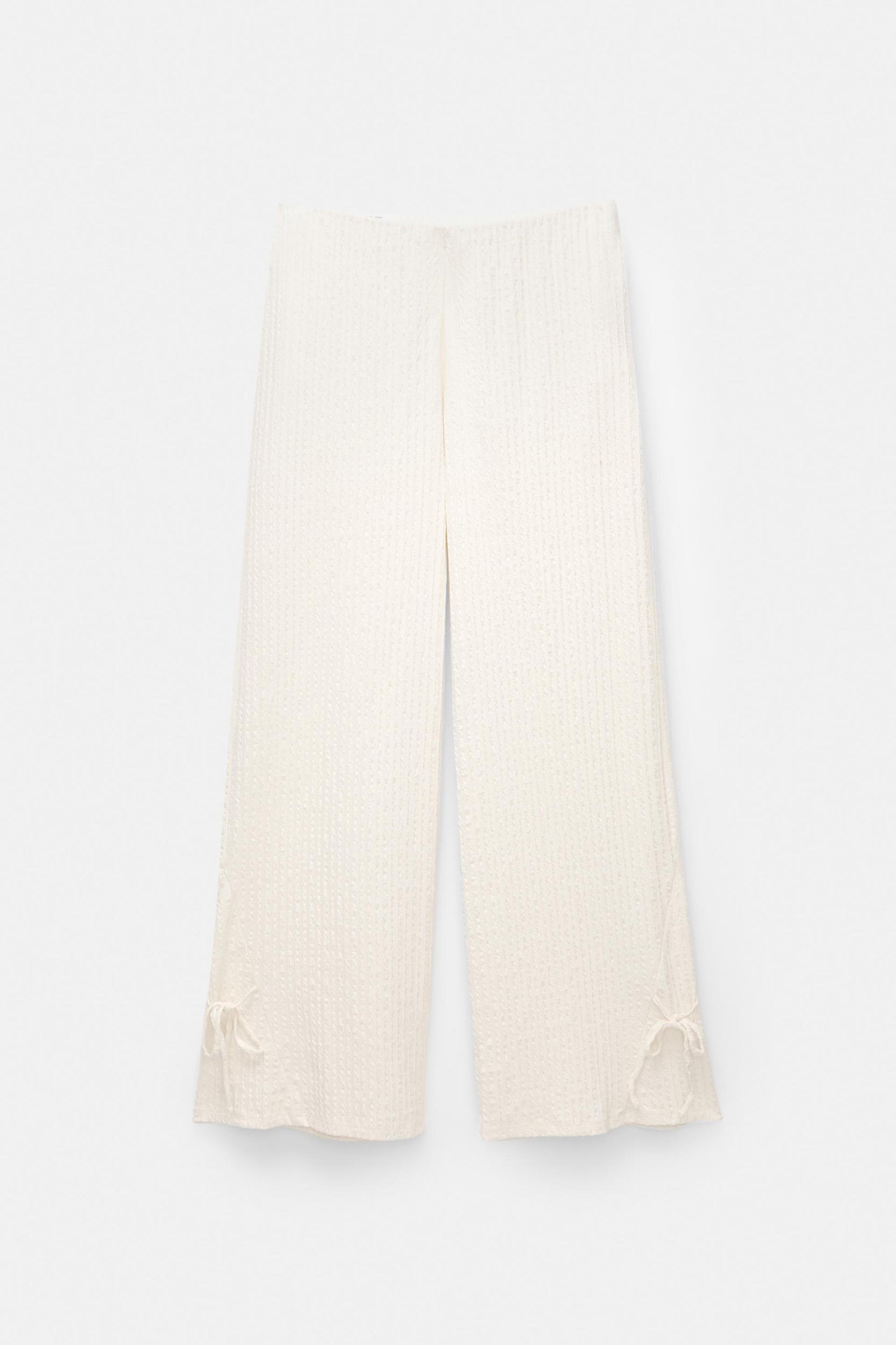 Rustic trousers with knot detail Product Image