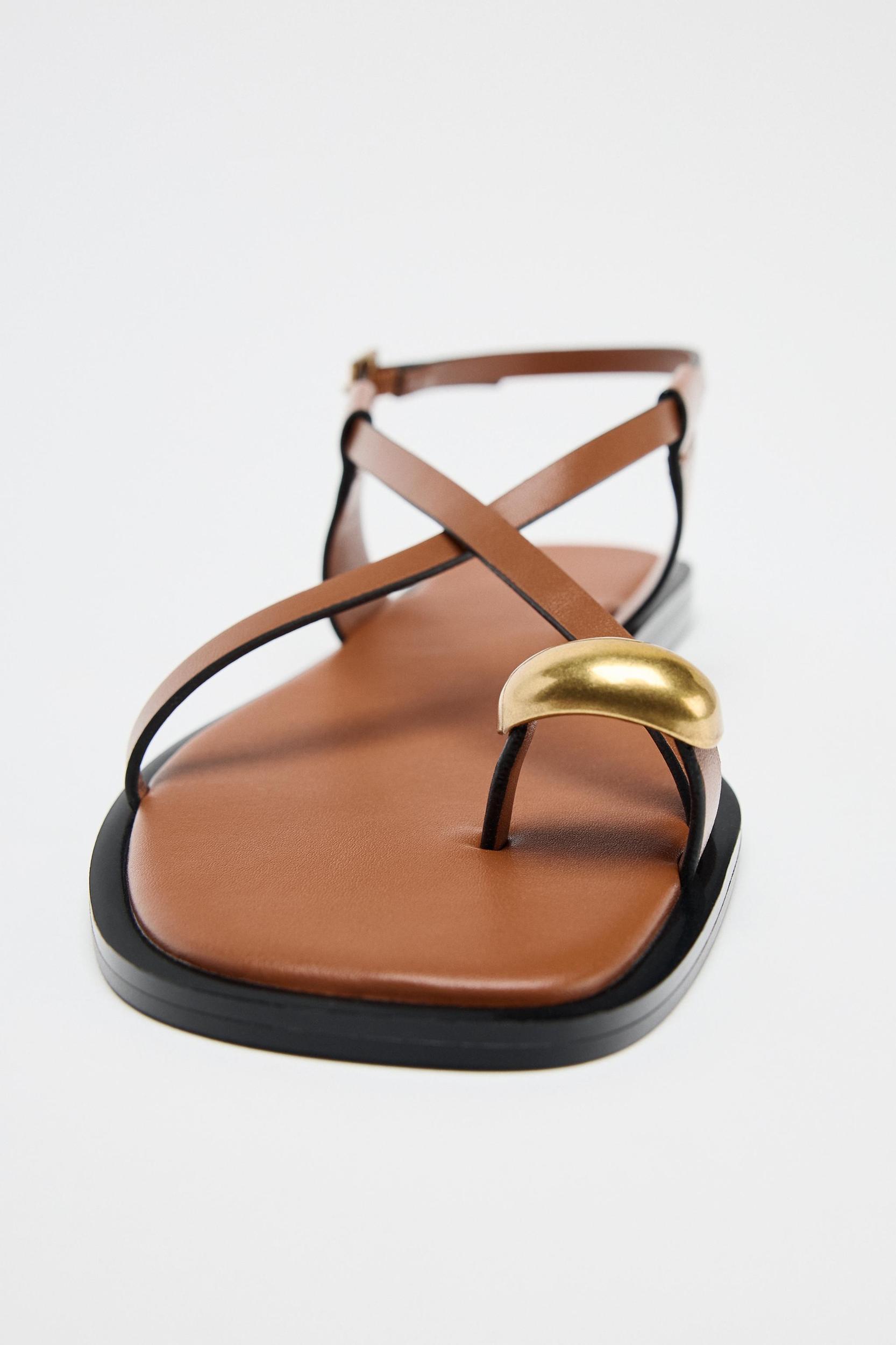 FLAT SANDALS WITH STRAPS AND METAL DETAIL Product Image