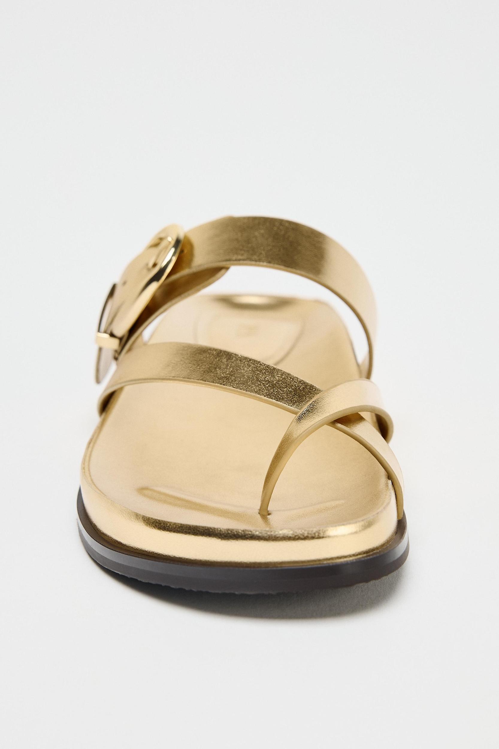METALLIC EFFECT CROSSED STRAP SANDALS Product Image