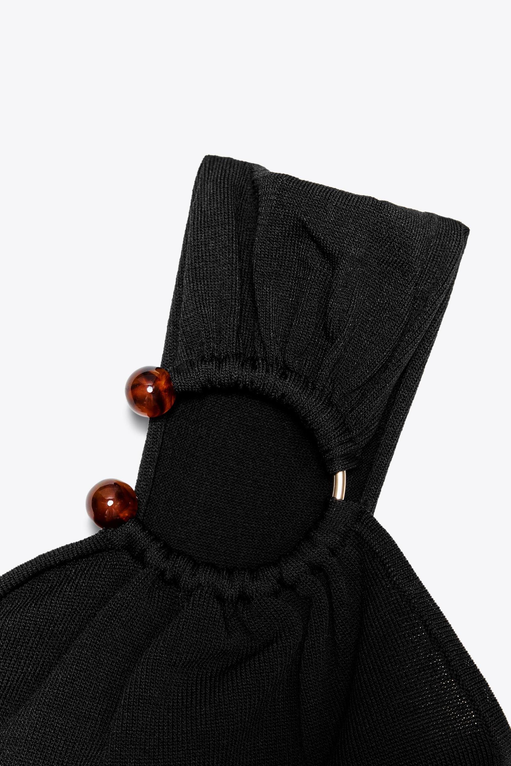 ASYMMETRIC APPLIQUÉ KNIT TOP Product Image