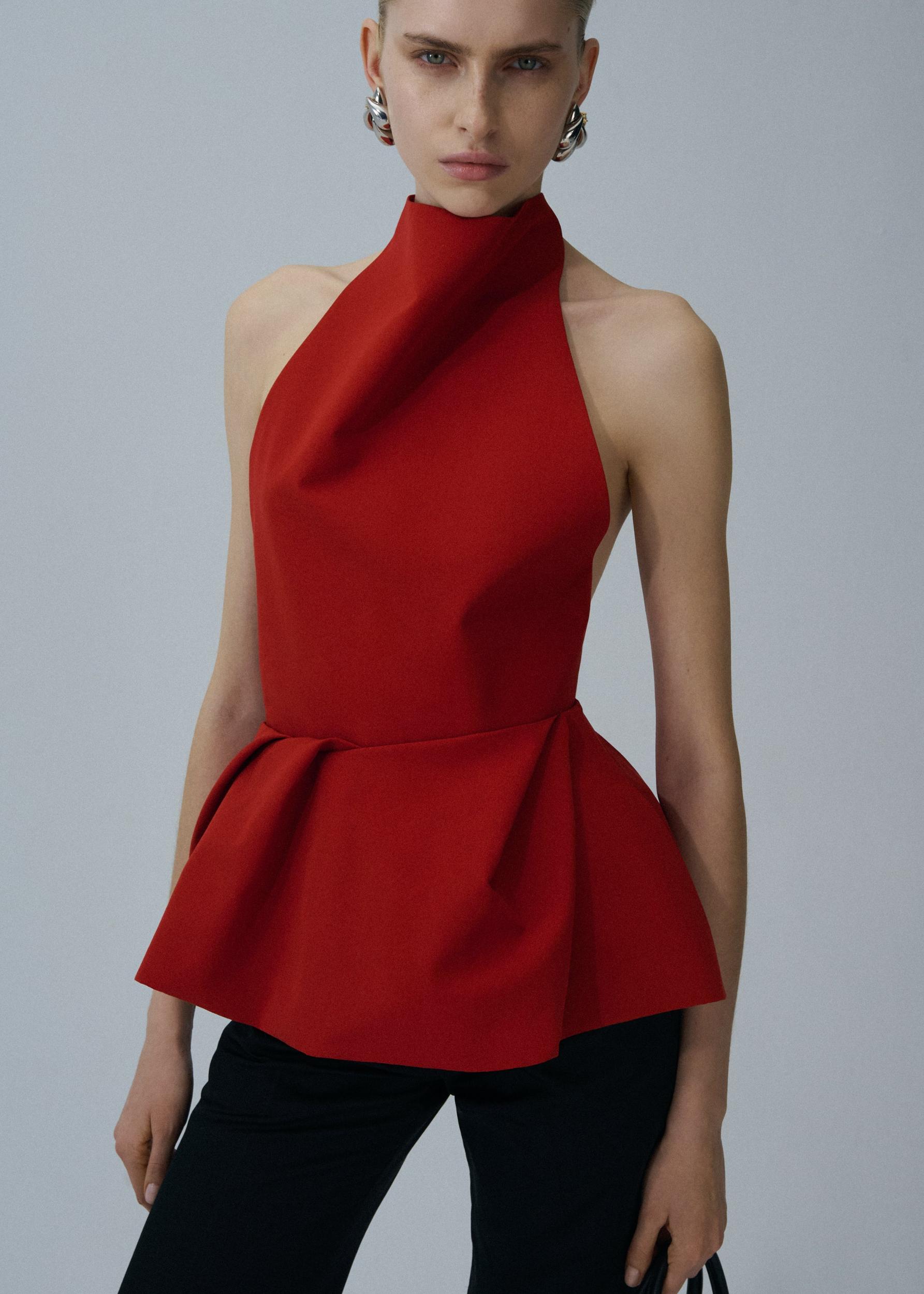 Halter peplum top in red Product Image