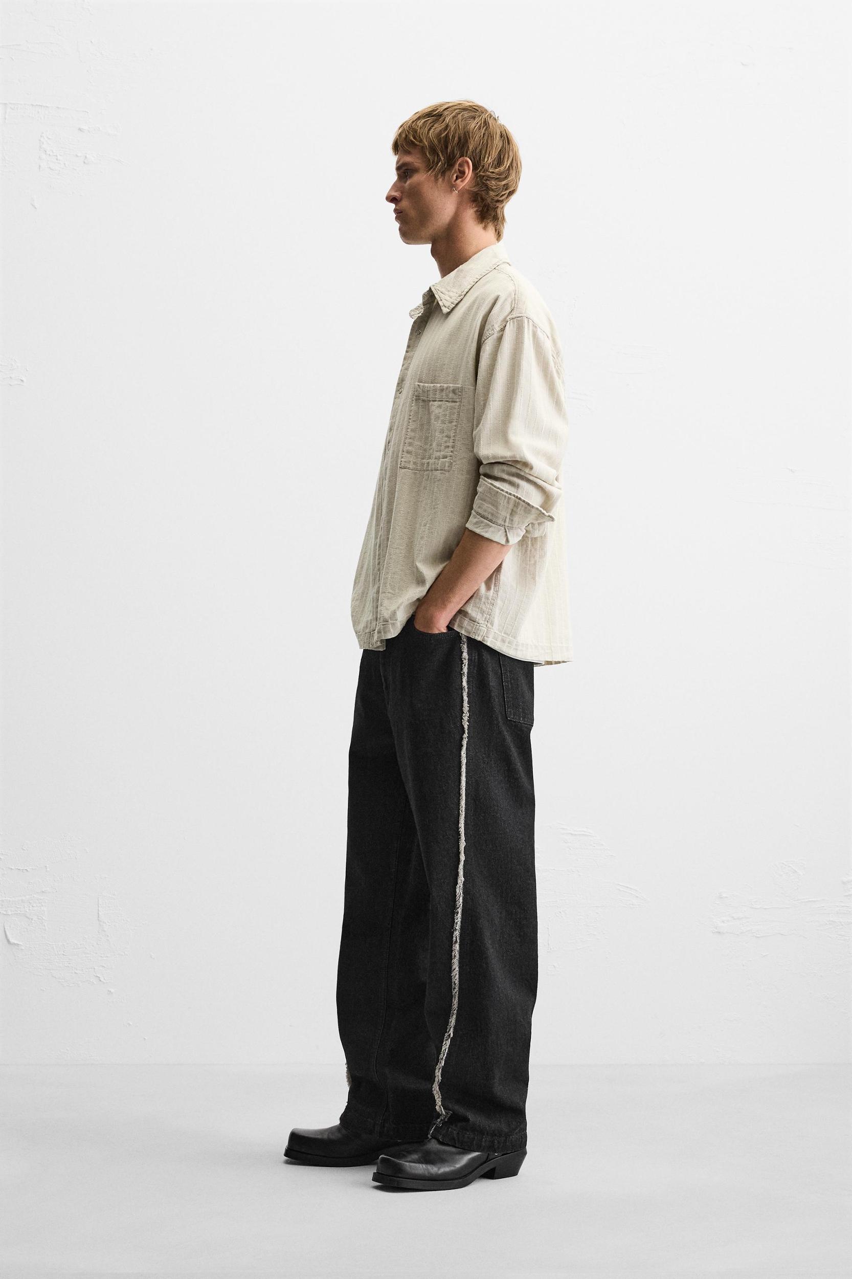 RELAXED FIT FRAYED SEAM JEANS Product Image