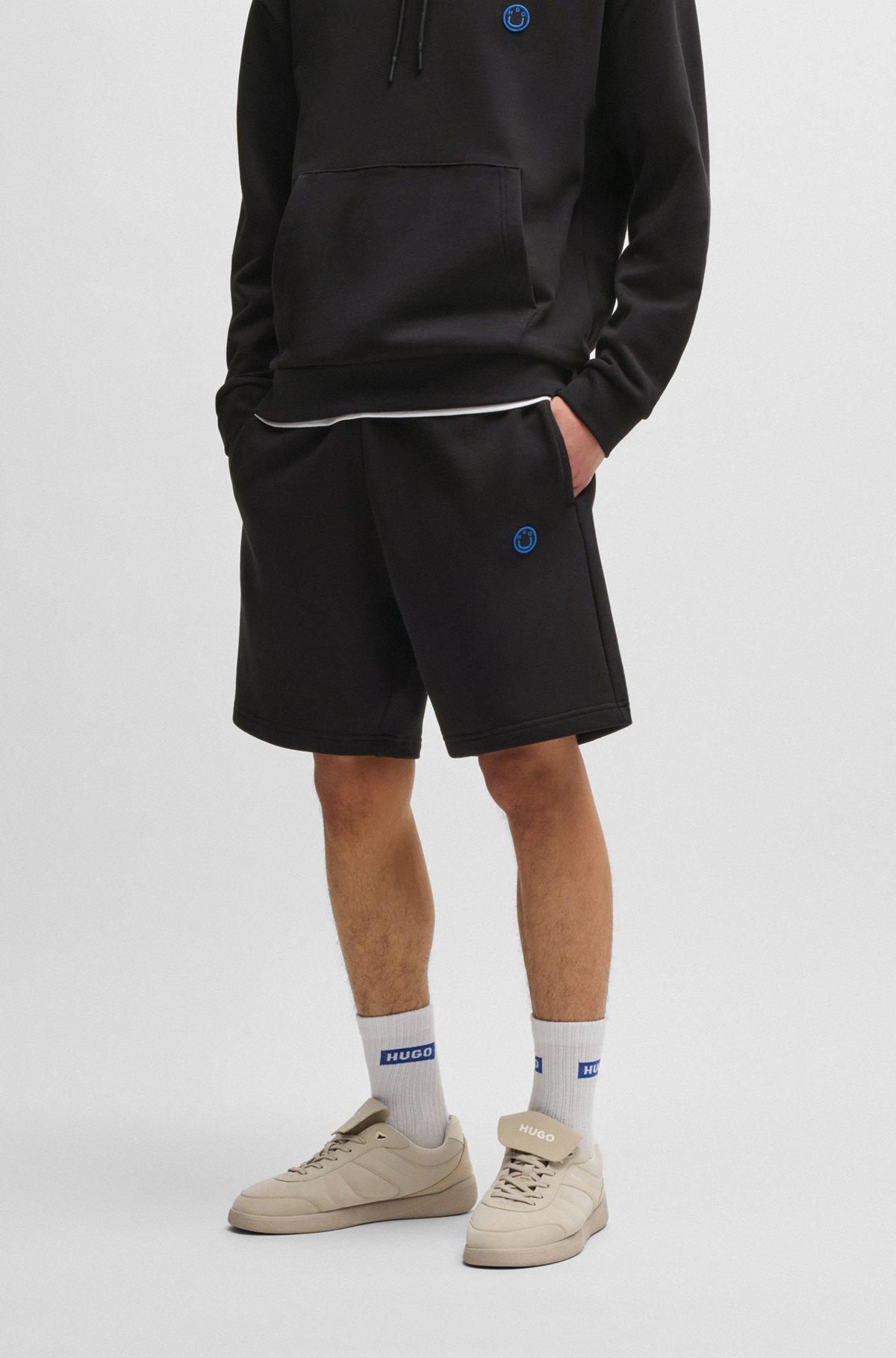 Cotton-terry shorts with Happy HUGO logo Product Image