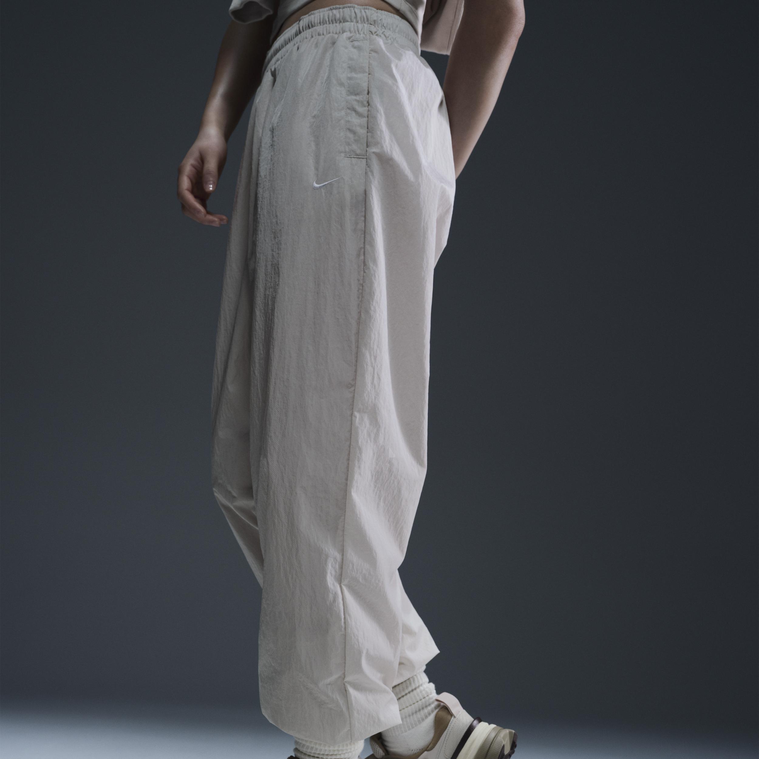 Women's Nike Sportswear Essential Mid-Rise Oversized Woven Jogger Pants Product Image