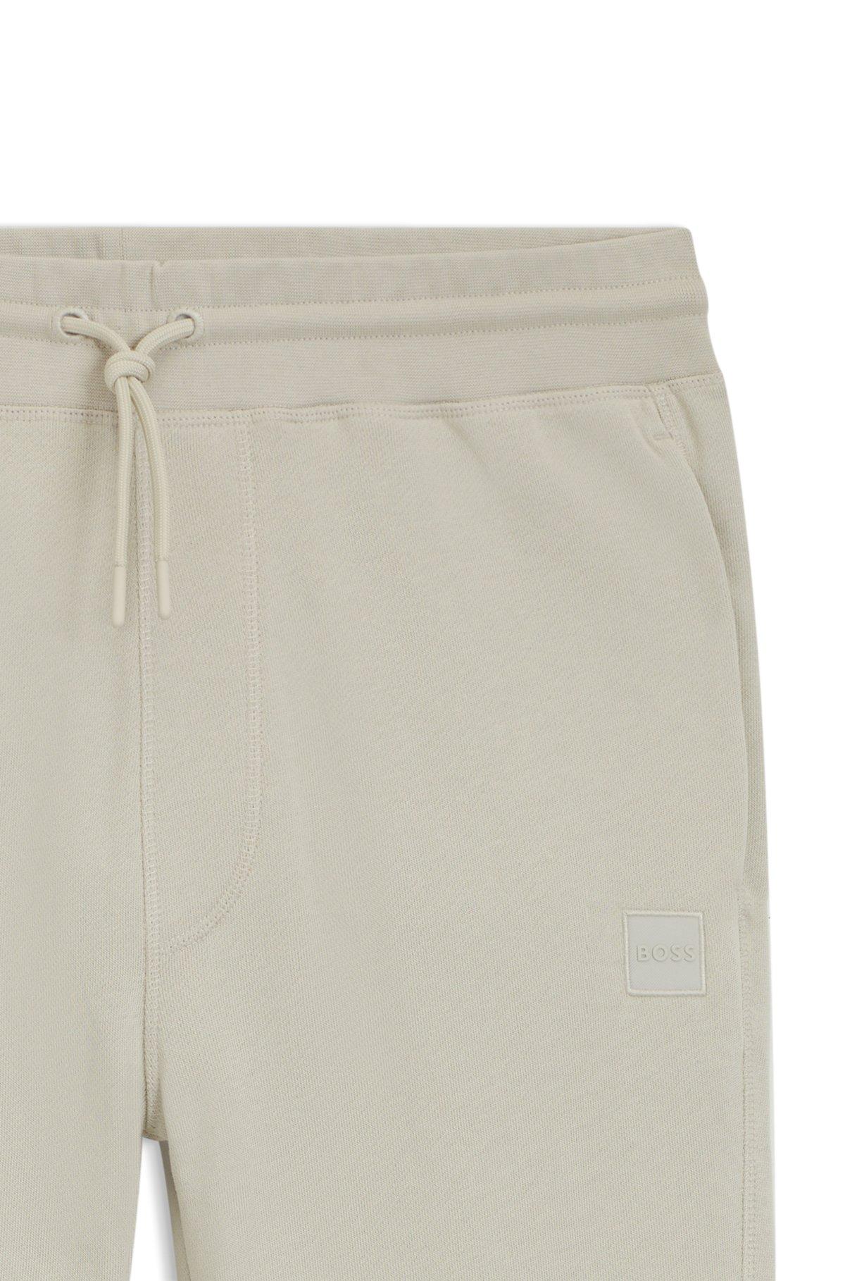Cotton-terry tracksuit bottoms with logo patch Product Image