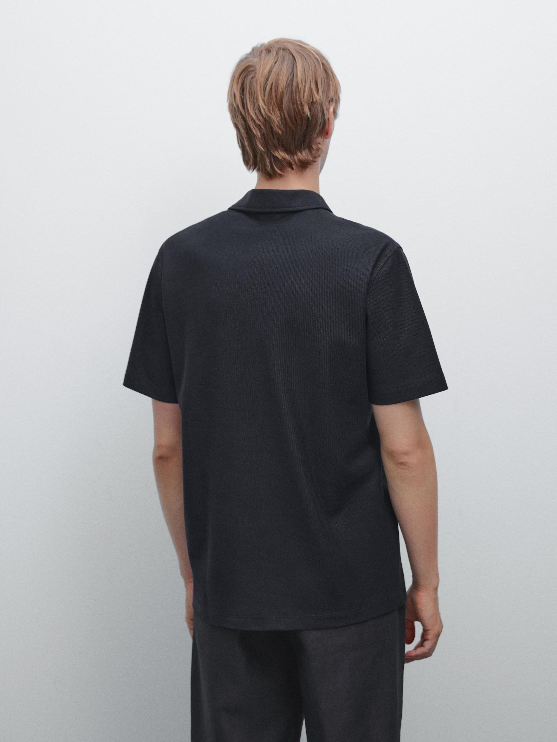 Textured polo shirt with hidden button Product Image