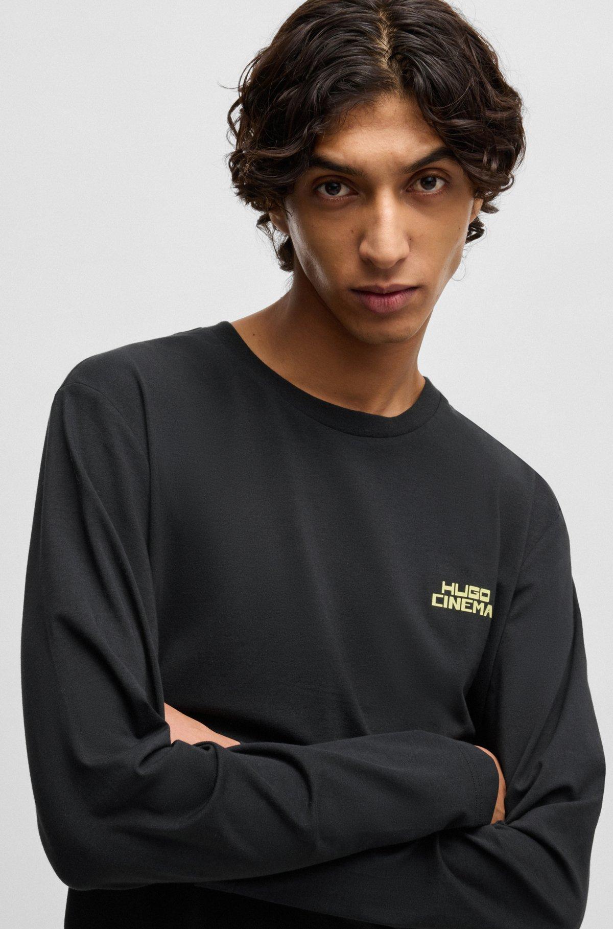 Stretch-cotton pajamas with 70s film graphics Product Image