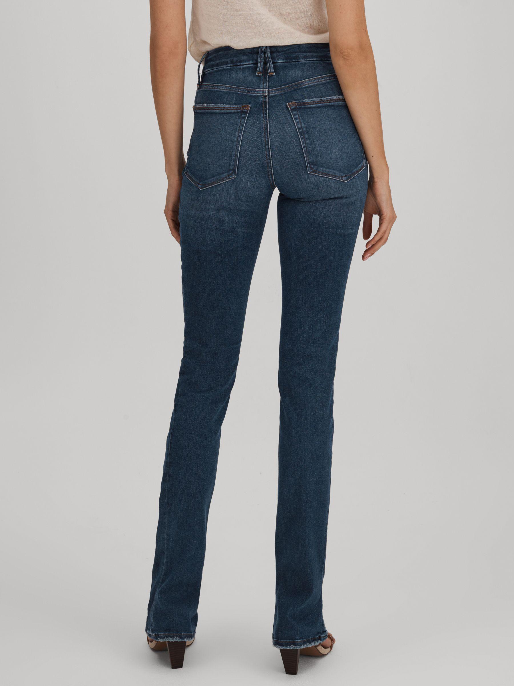 Good American Distressed Bootcut Jeans in Indigo Product Image