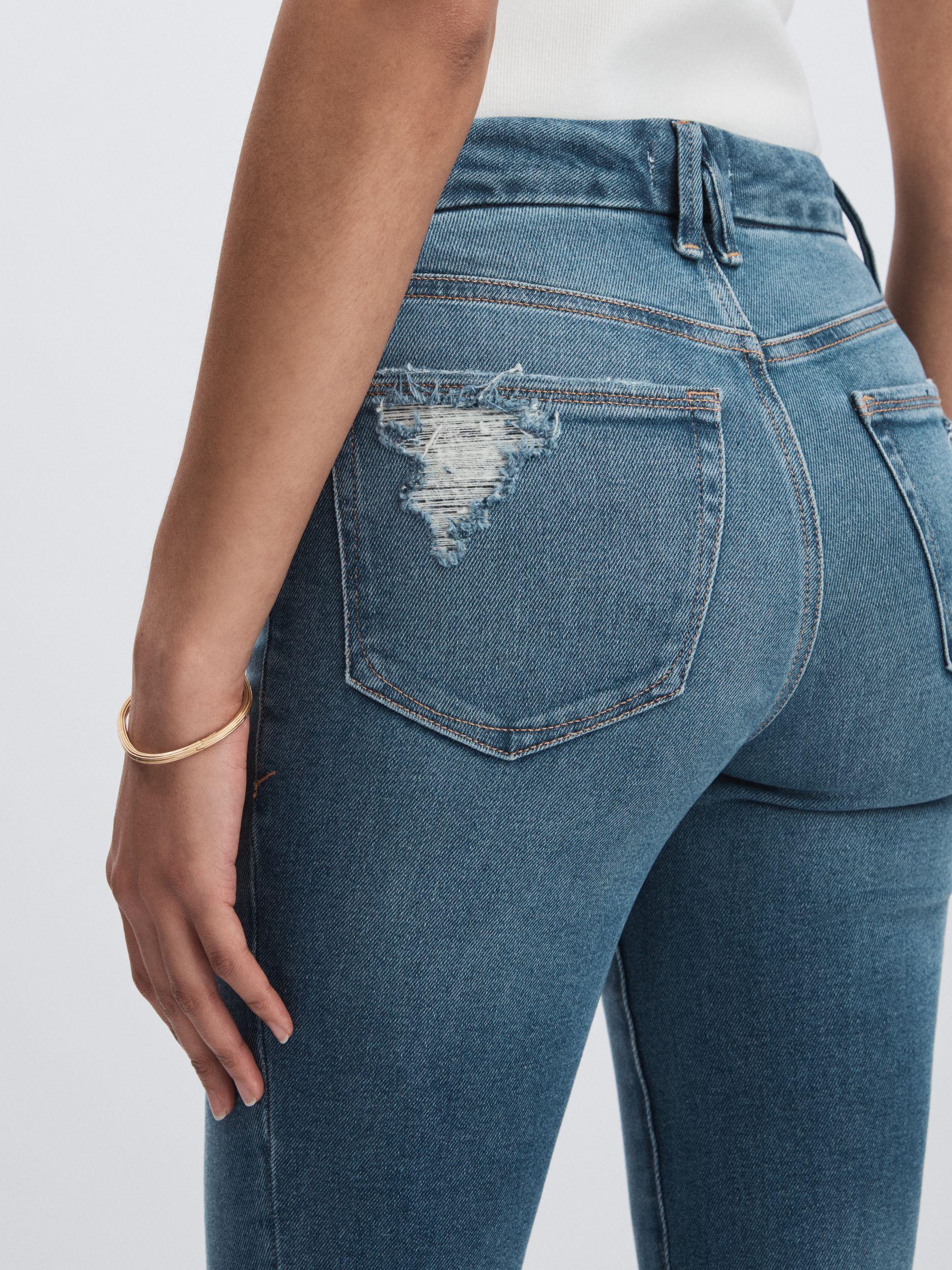 Good American Flared Distressed Jeans in Dark Indigo Product Image