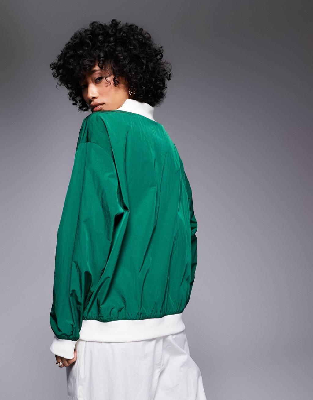 Nike Essential woven long sleeve v neck sweater in green Product Image