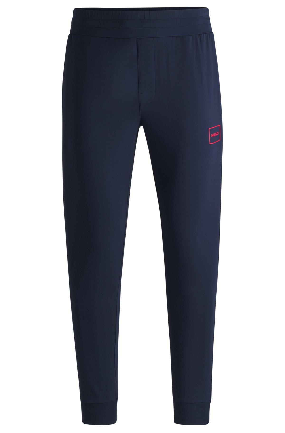 Logo-print tracksuit bottoms in stretch cotton Product Image