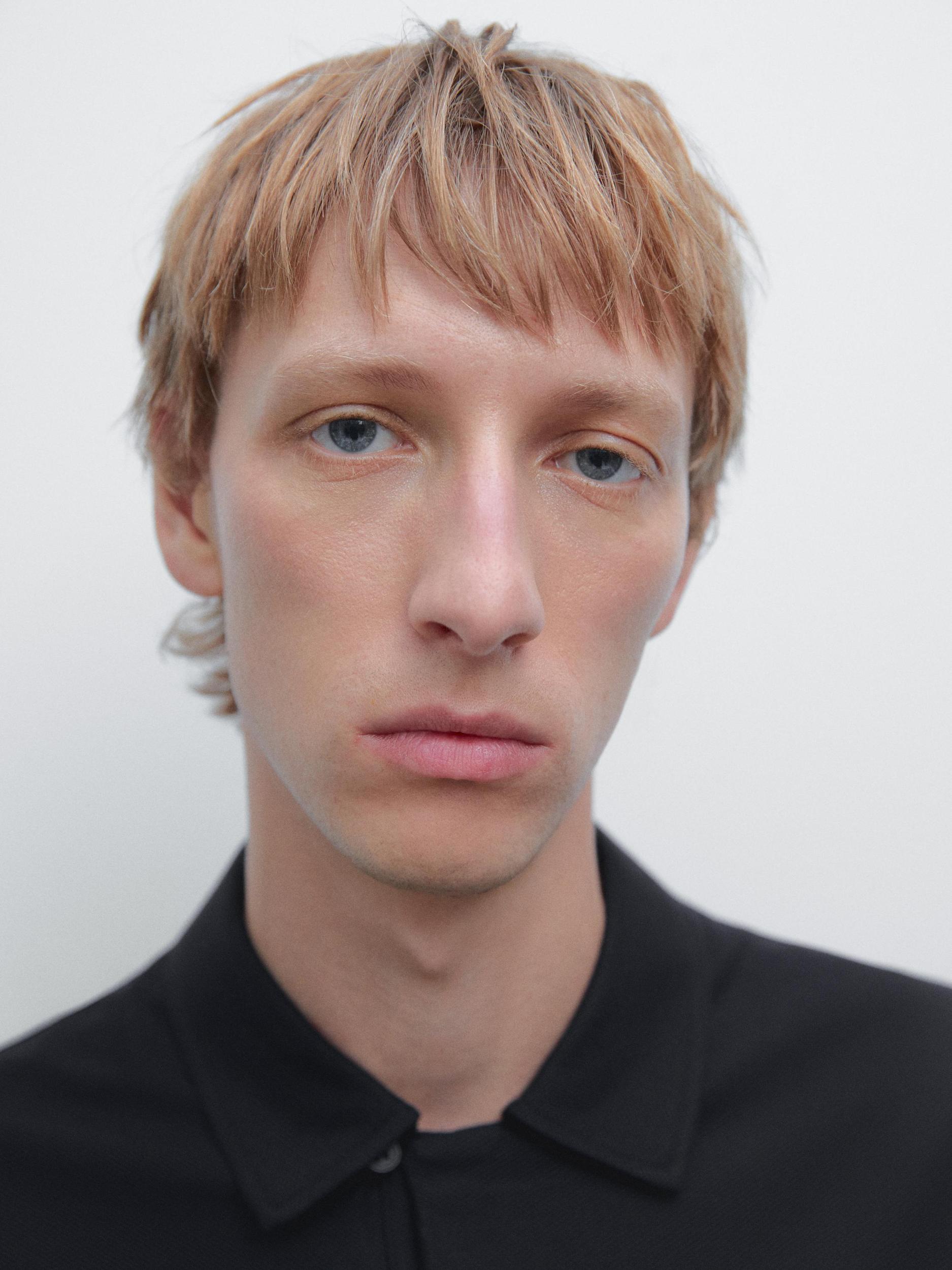 Textured polo shirt with hidden button Product Image