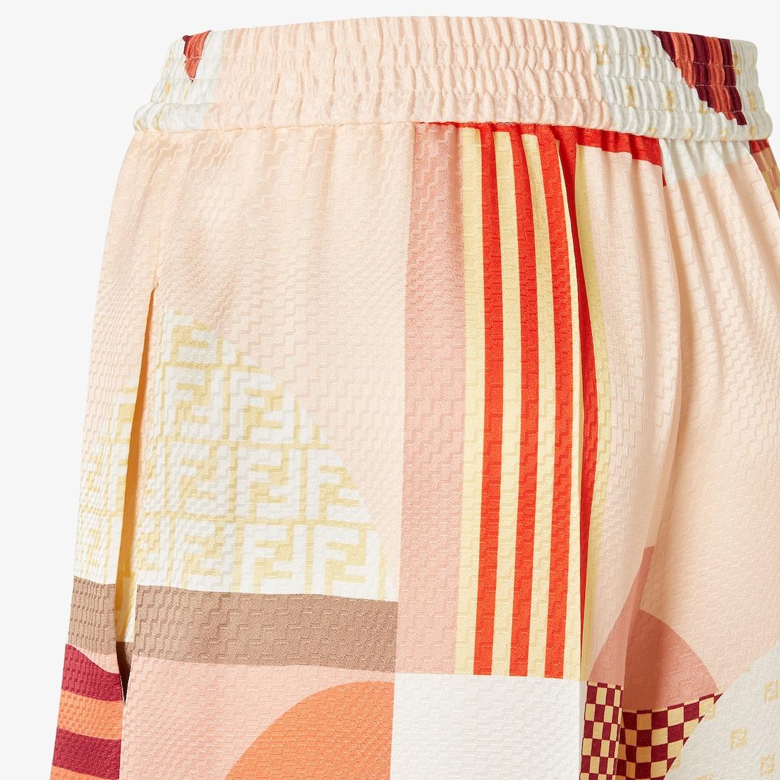 PantsPink silk pants with patchwork print Product Image
