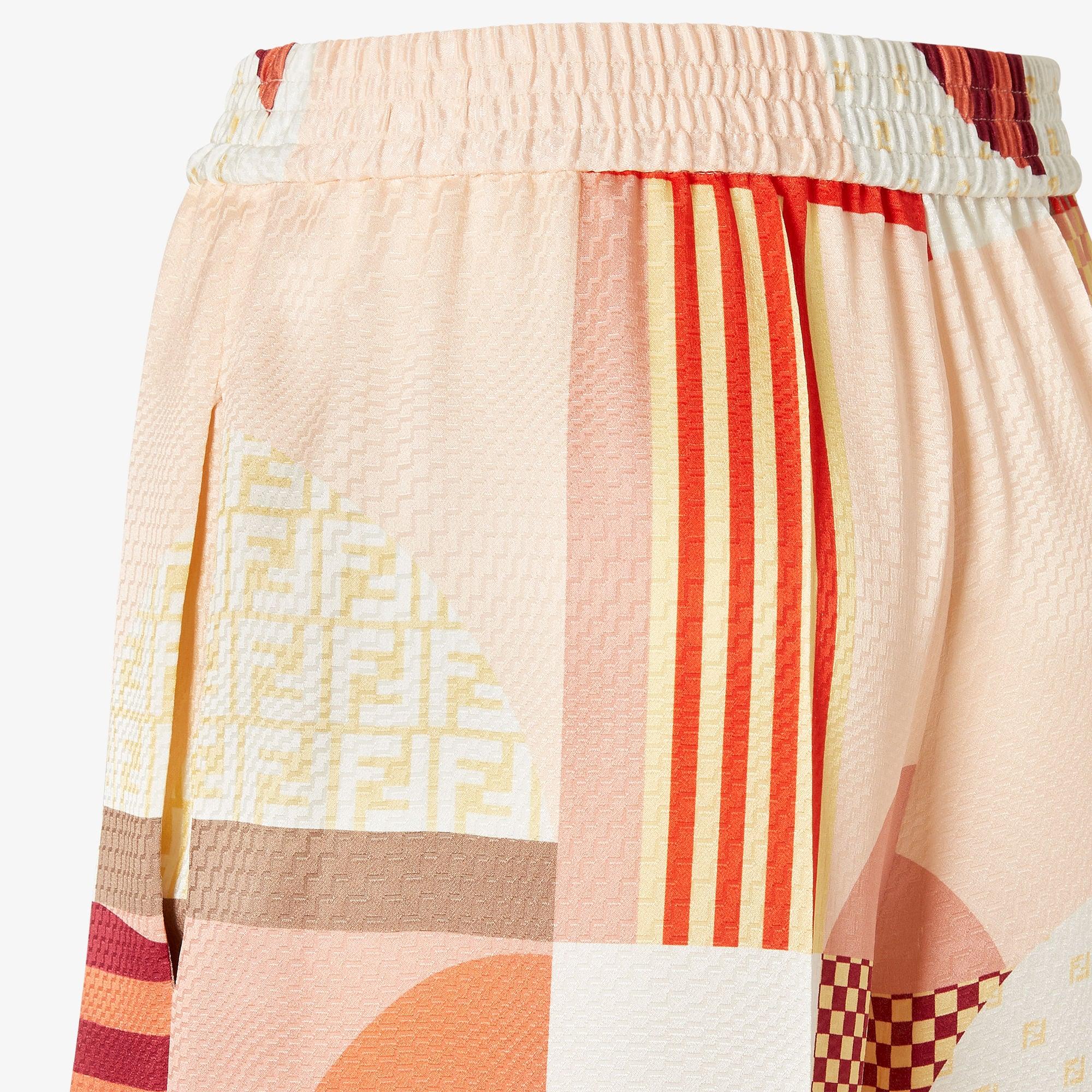 PantsPink silk pants with patchwork print Product Image