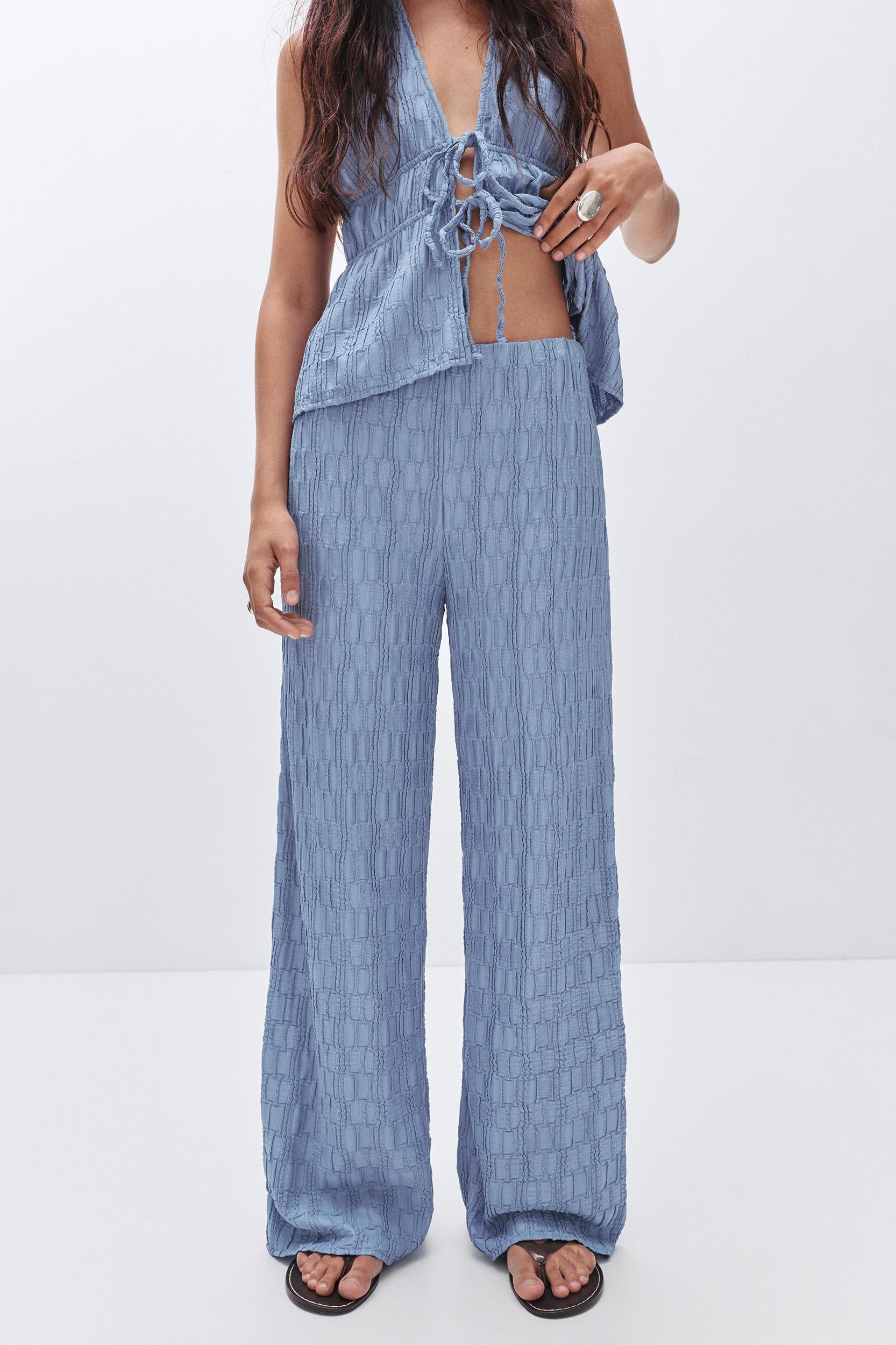 Textured bell bottom trousers Product Image