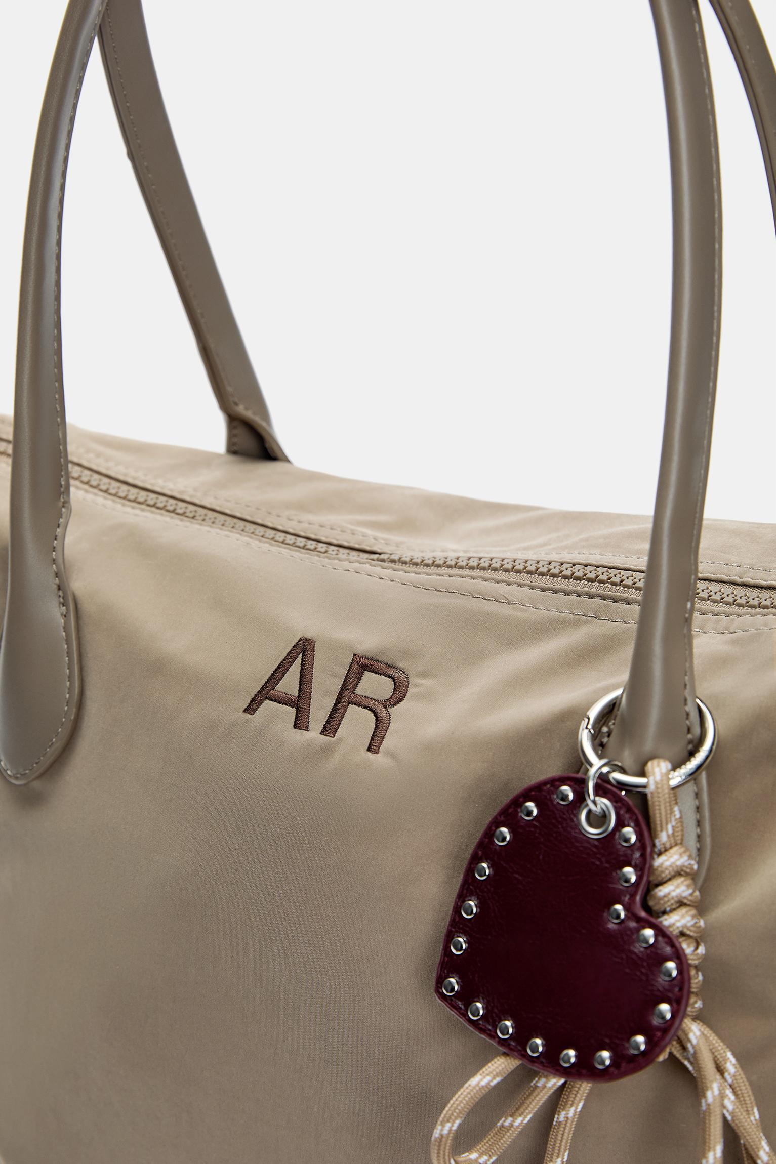 Nylon shopper bag with charm detail Product Image