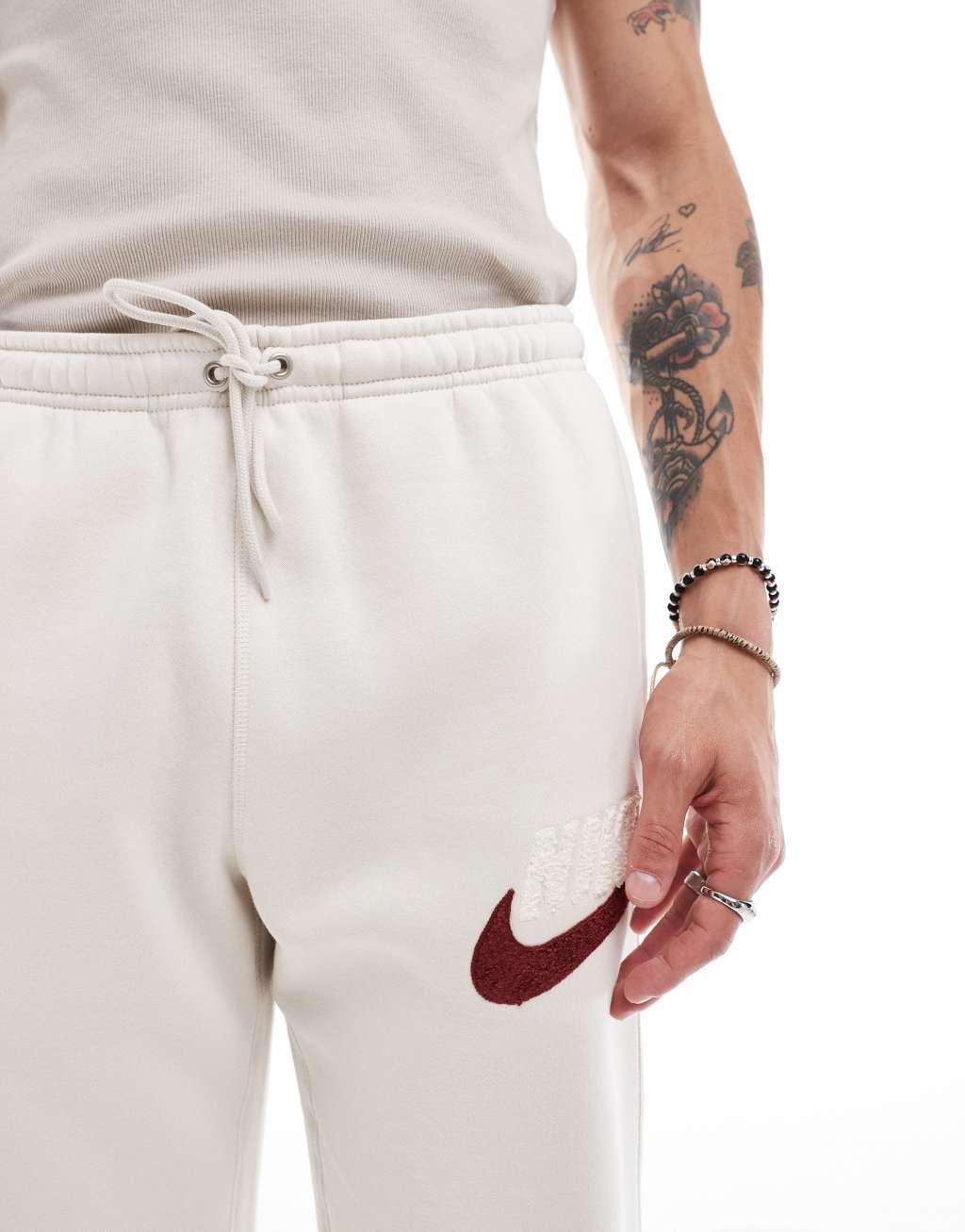Nike Club Chenile Futura logo joggers in beige Product Image