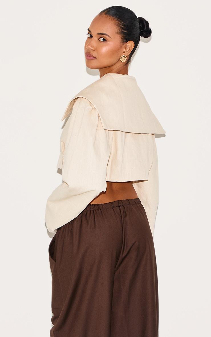 Sand Cross Over Asymmetric Cropped Jacket Product Image