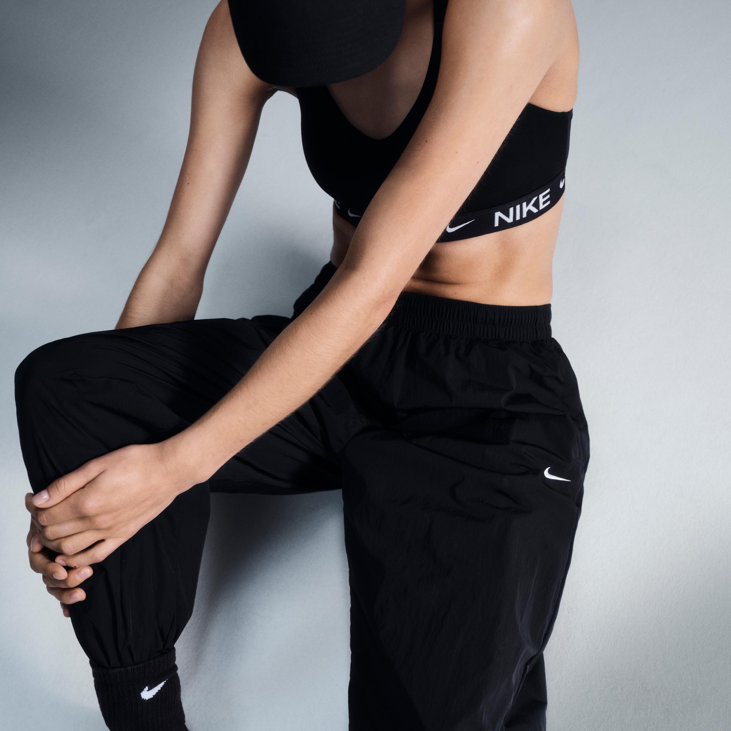 Women's Nike Sportswear Essential Mid-Rise Oversized Woven Jogger Pants Product Image