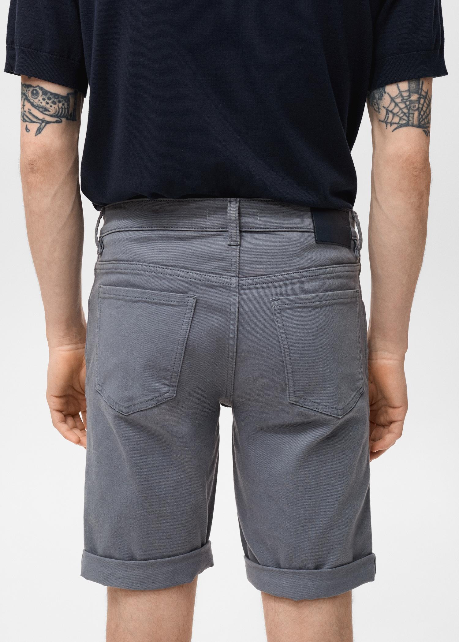 Slim-fit denim bermuda shorts - Men | MANGO USA Product Image