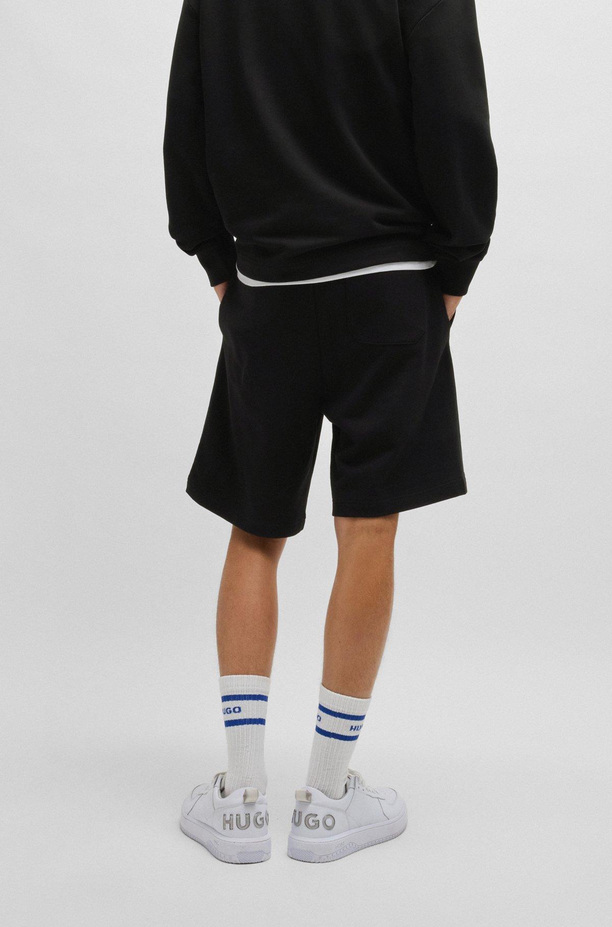 Cotton-terry shorts with blue logo patch Product Image