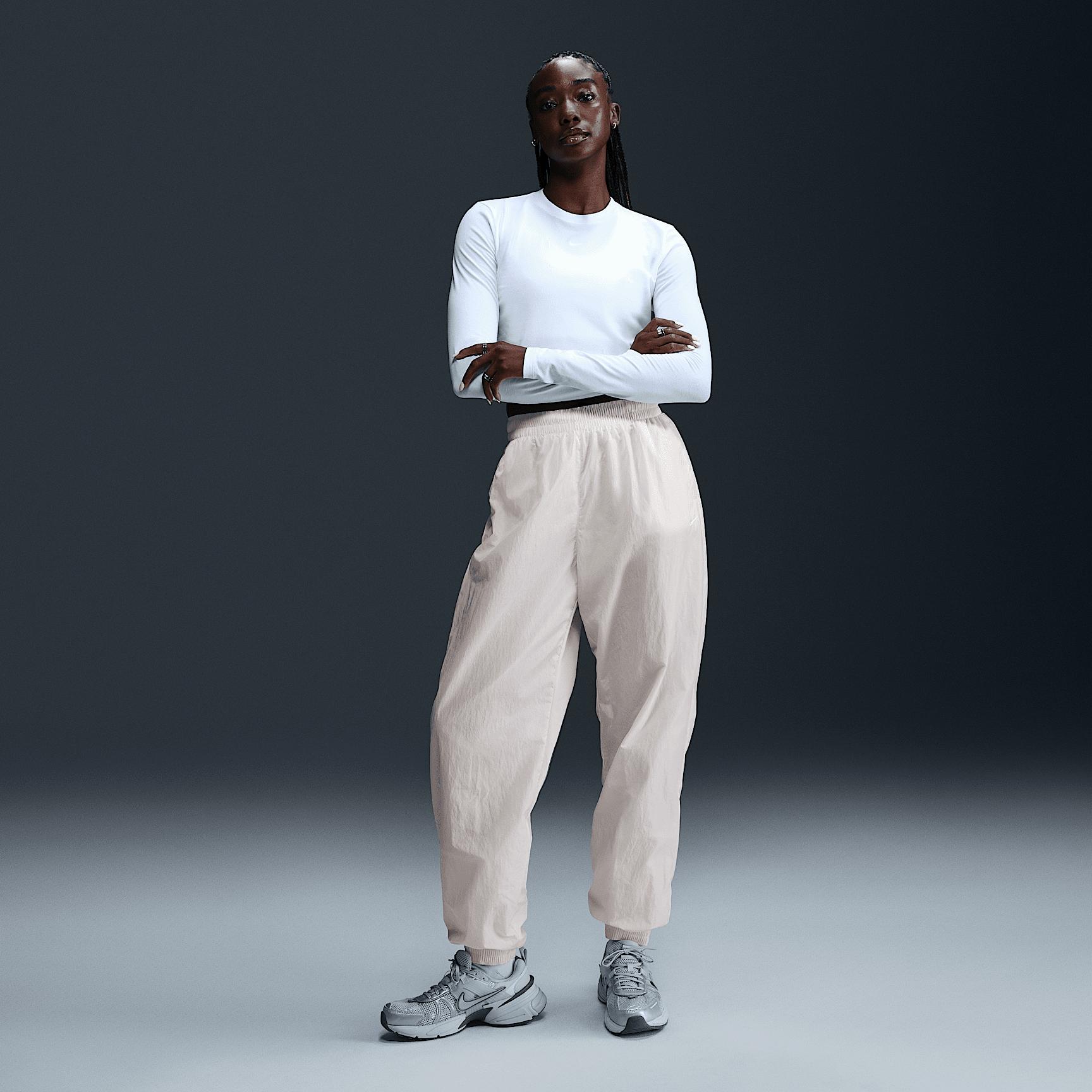 Womens Nike Sportswear Essential Mid-Rise Oversized Woven Jogger Pants | FV7668-004 Product Image