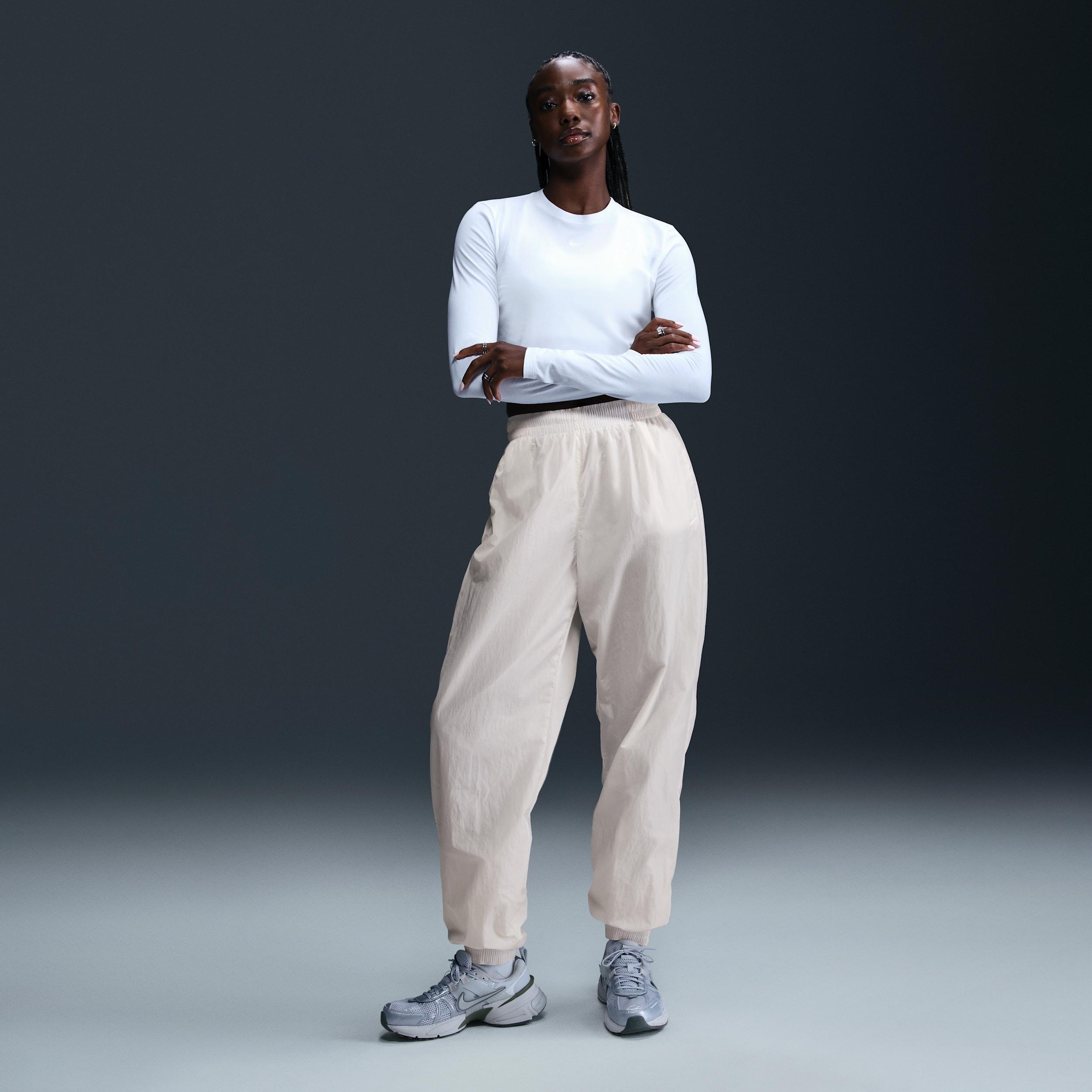 Womens Nike Sportswear Essential Mid-Rise Oversized Woven Jogger Pants | FV7668-004 Product Image